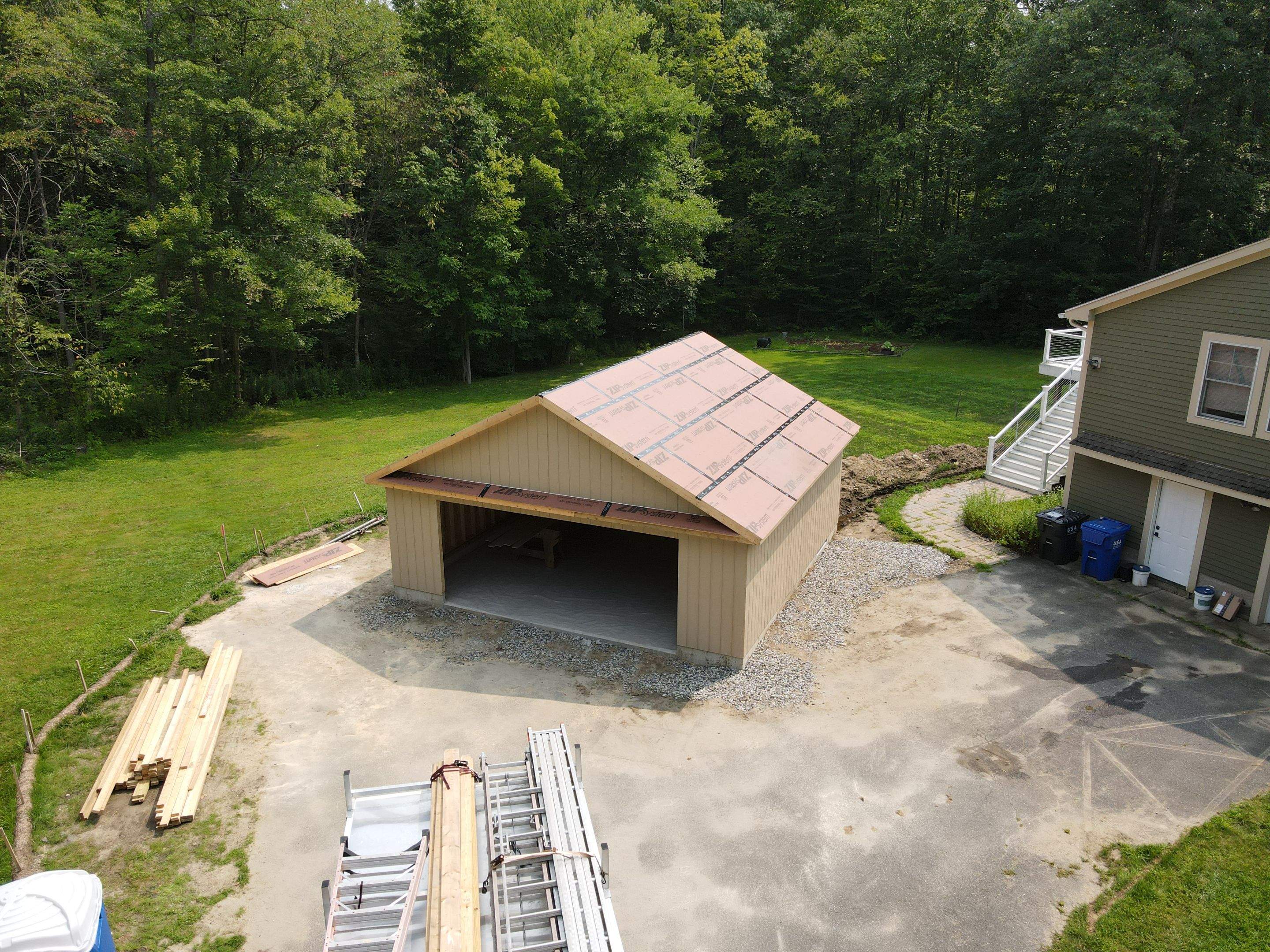 Two-Car Garage using LP SmartSide Panel Siding by Chagnon Building & Remodeling LLC