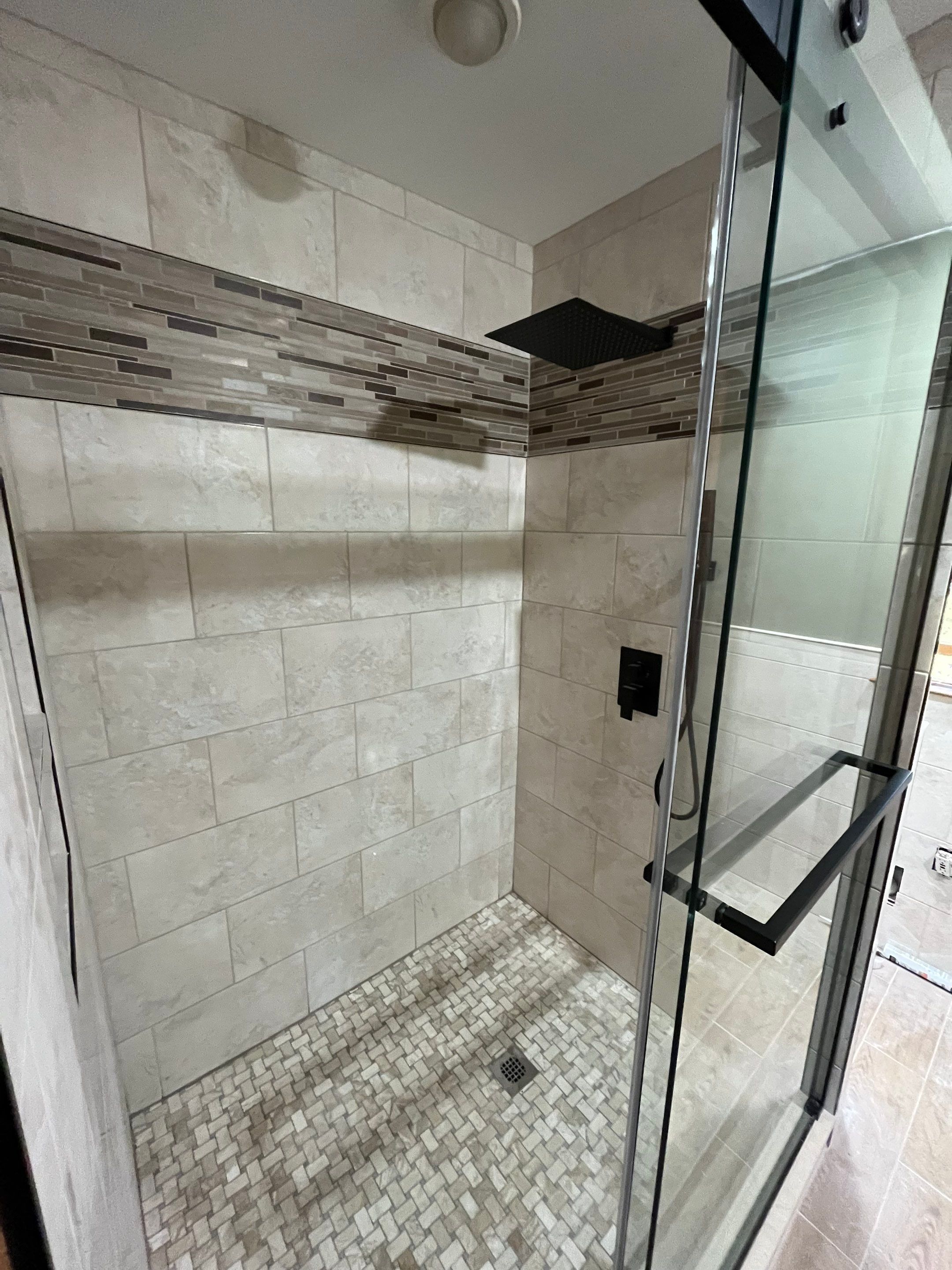 Bathroom Remodel using Tile by Home Concepts Construction