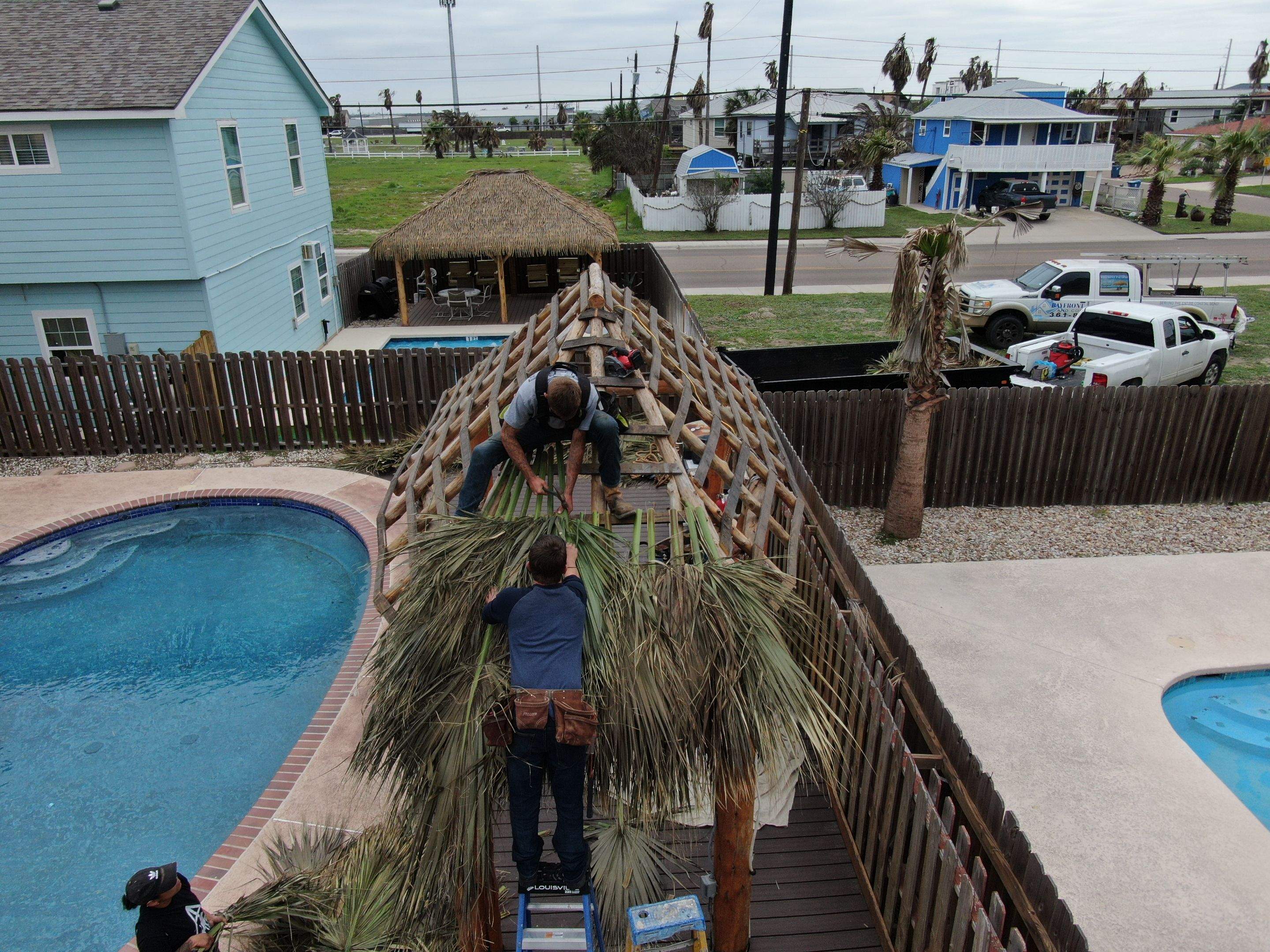 Poolside paradise by Bayfront Roofing and Construction
