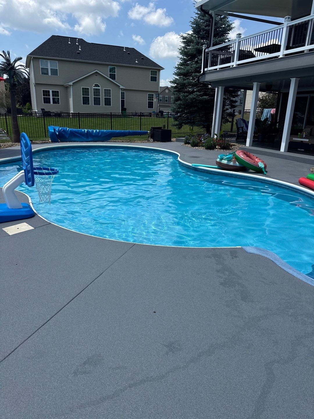 Twilight Pool Deck / Patio Project in Beaver falls by Floors in a Day, Inc