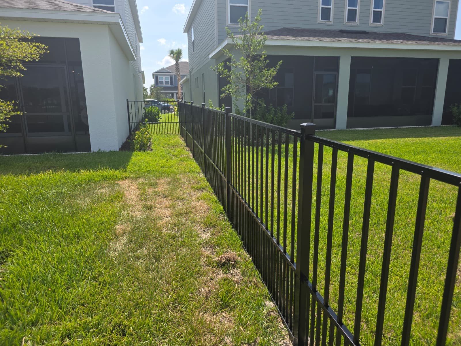 Black Aluminum Puppy Picket Fence Installation in Nokomis by True Fence LLC