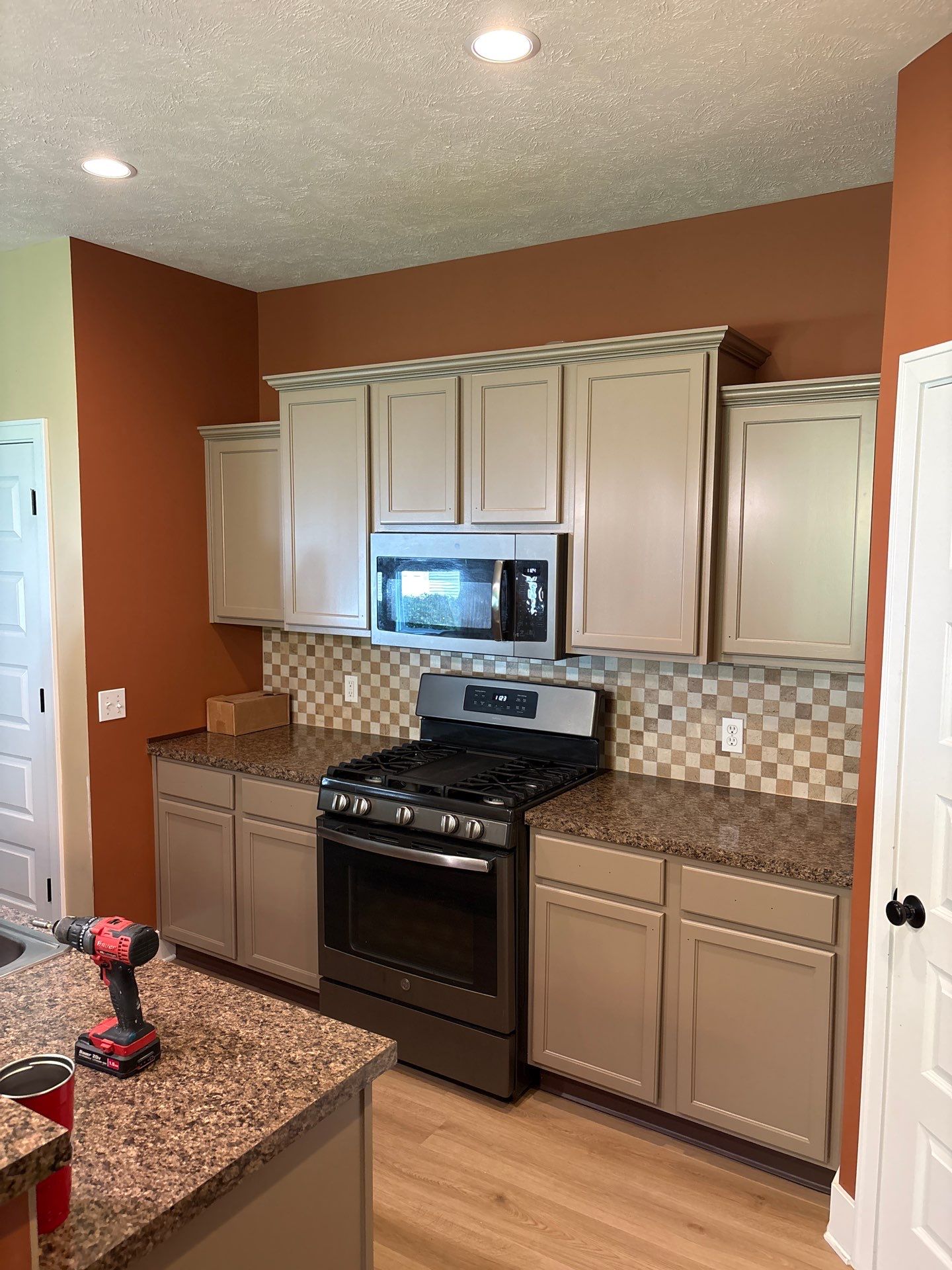 Sage Green Kitchen Cabinet Refinishing and Renovation in Webberville by Top Shelf Painter