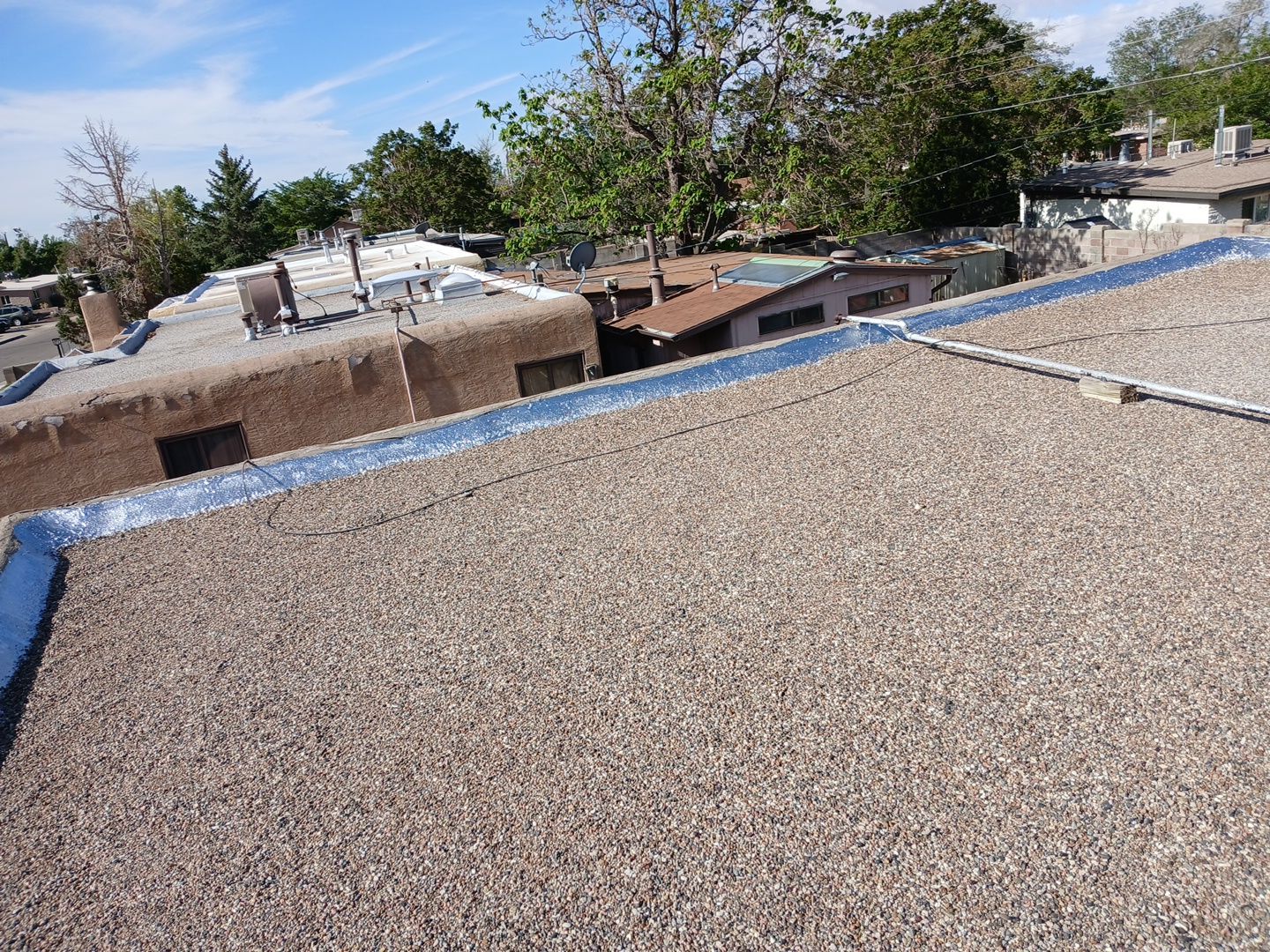 Albuquerque Flat Roof Replacement Using Tan Modified Bitumen Membrane by Doyle Roof Masters Inc