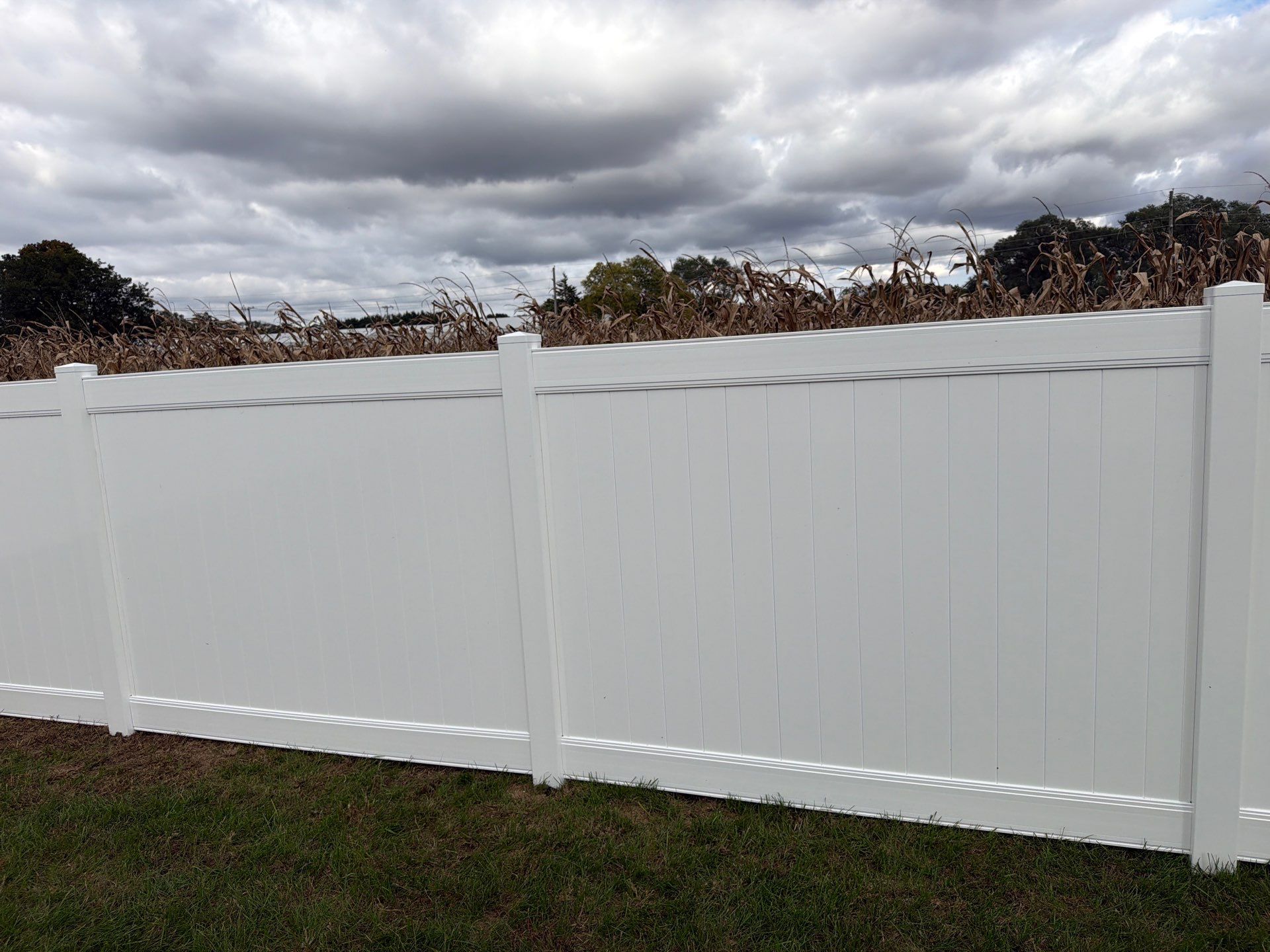 Residential White Vinyl Privacy Fence Installation in Janesville by Perfect Picket Fence and Stain