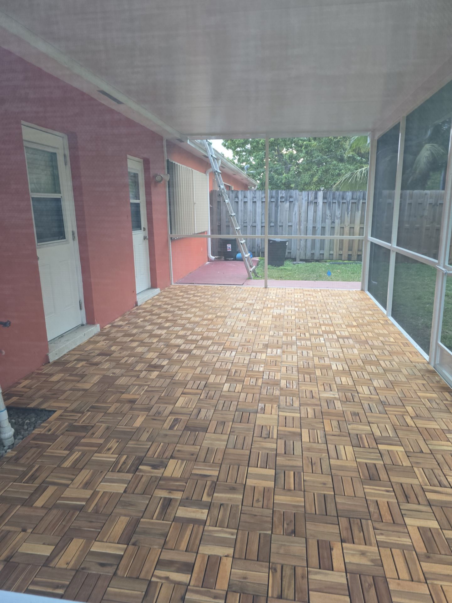 Insulated Screen Enclosure and Wood Tile Deck Installation in Plantation by Aastro Roofing