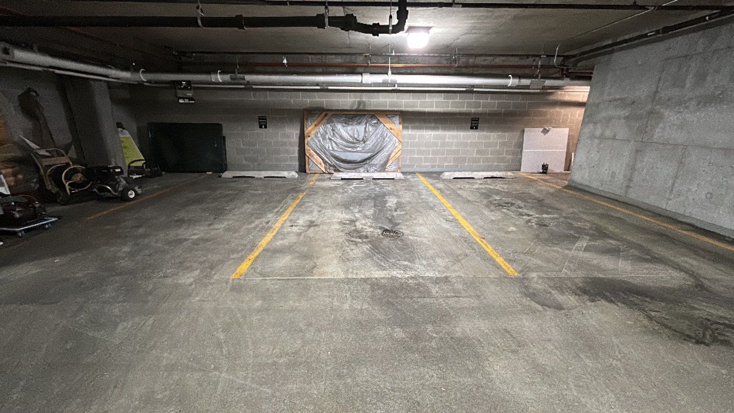 Parking garage using Hot water by Northern Power Washing LLC.