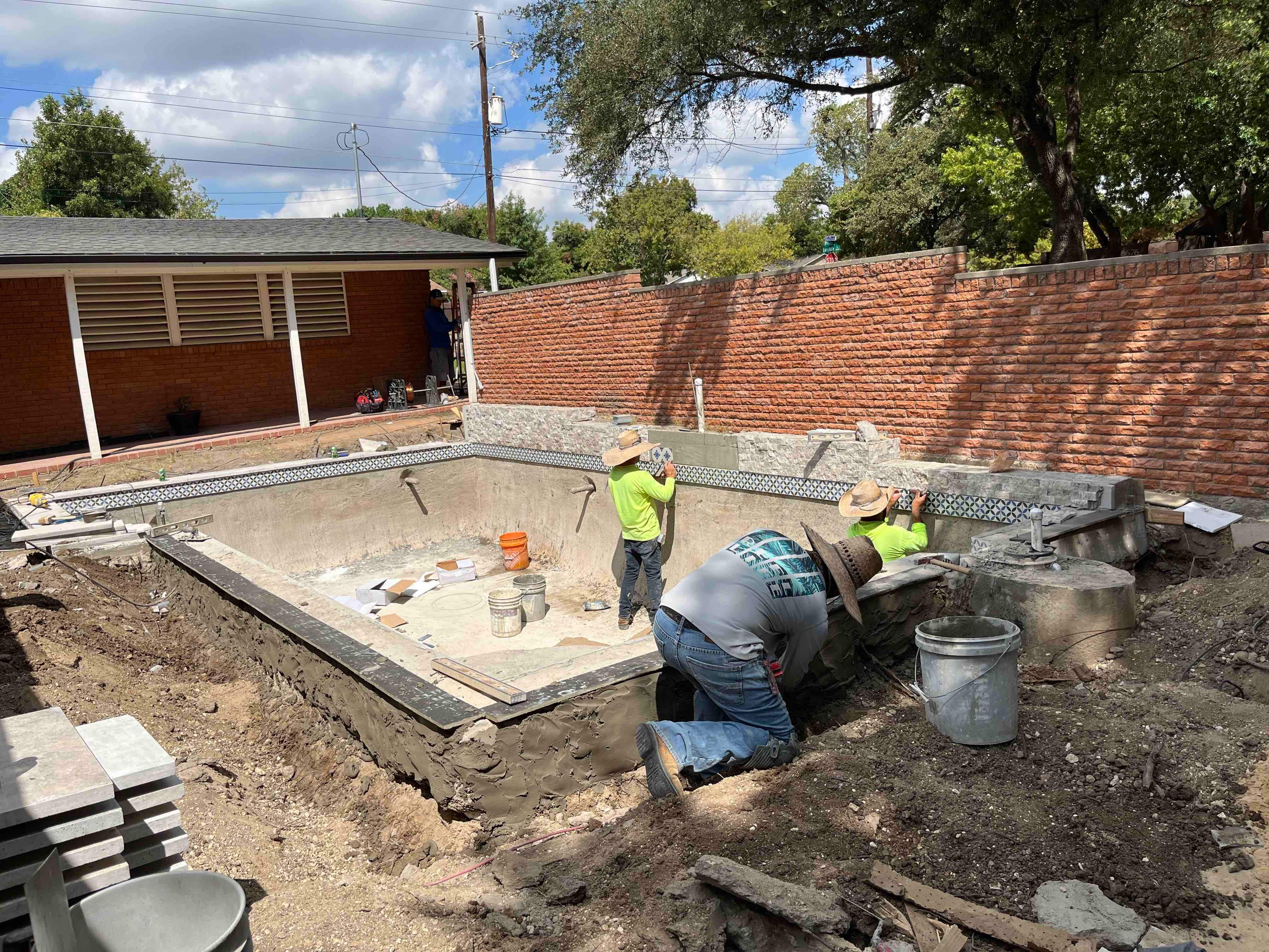 Geometric Pool with Raised Stone Wall and Sheer Descent by Pinnacle Pools and Spas - DFW