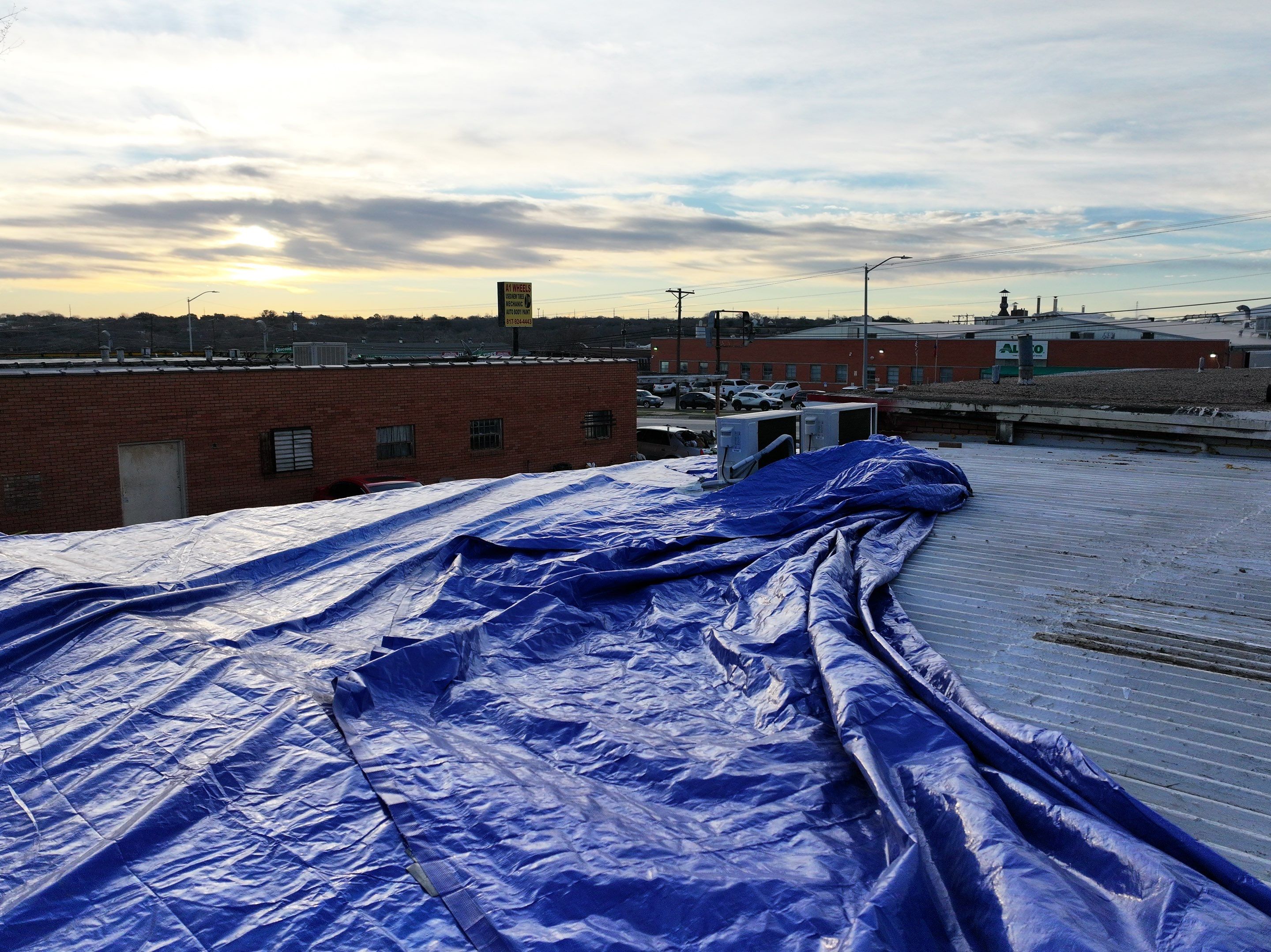 Commercial roofing overlay using GAF TPO over an old ballast roof by Becker Roofing and Exteriors