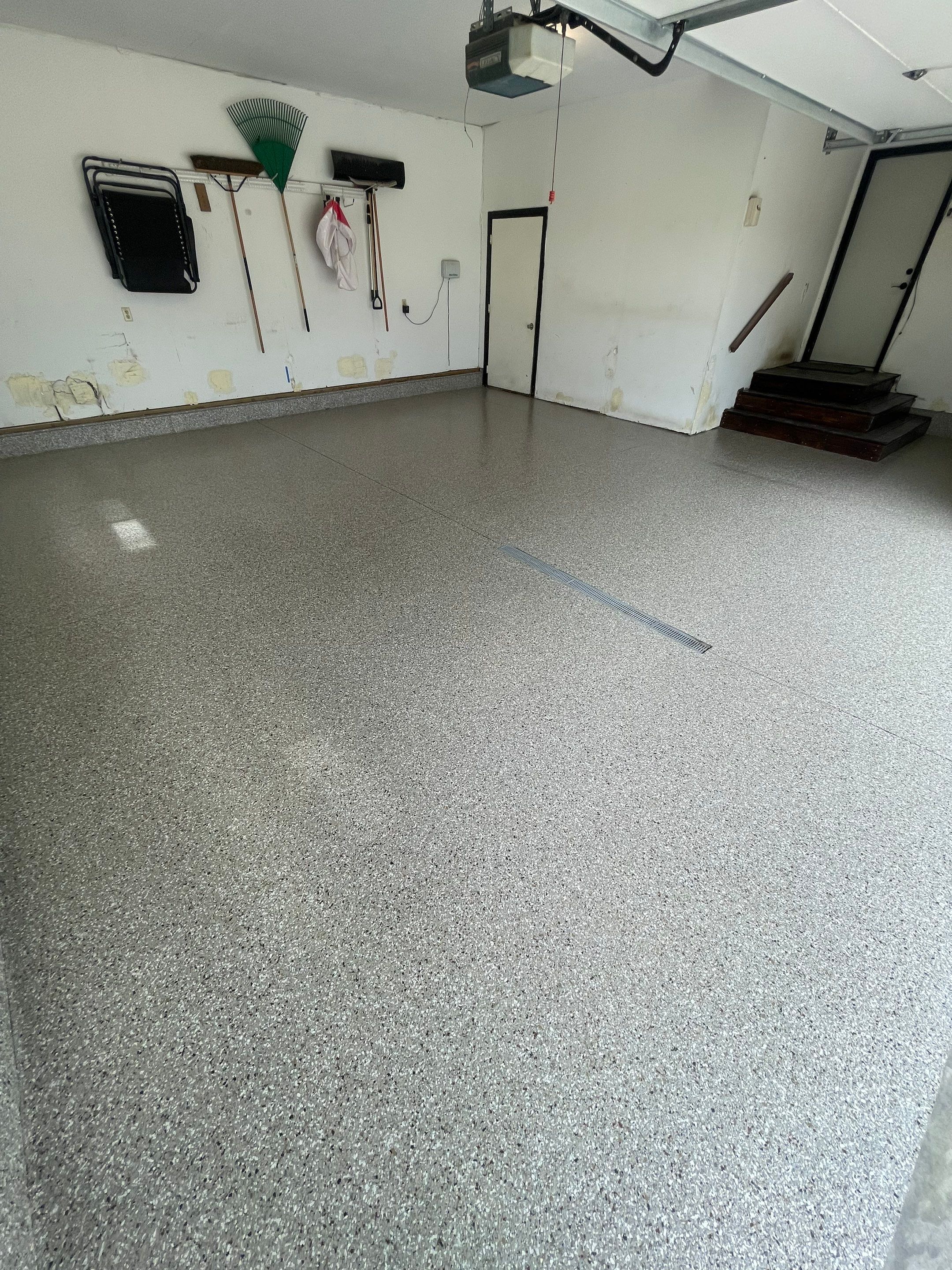 Hartford Residential Garage Floor Transformation With Decorative Chip Coating by Select Painting, Coatings & Garage Cabinets