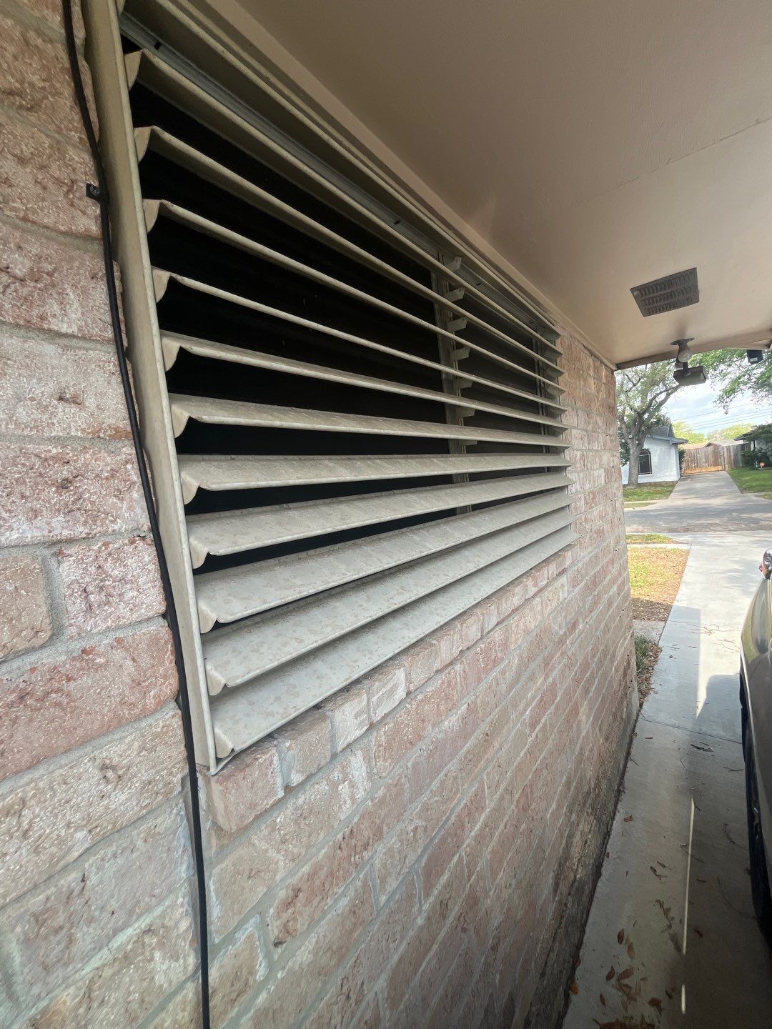 Colored Vinyl Windows to blend into brick by Bayfront Roofing and Construction