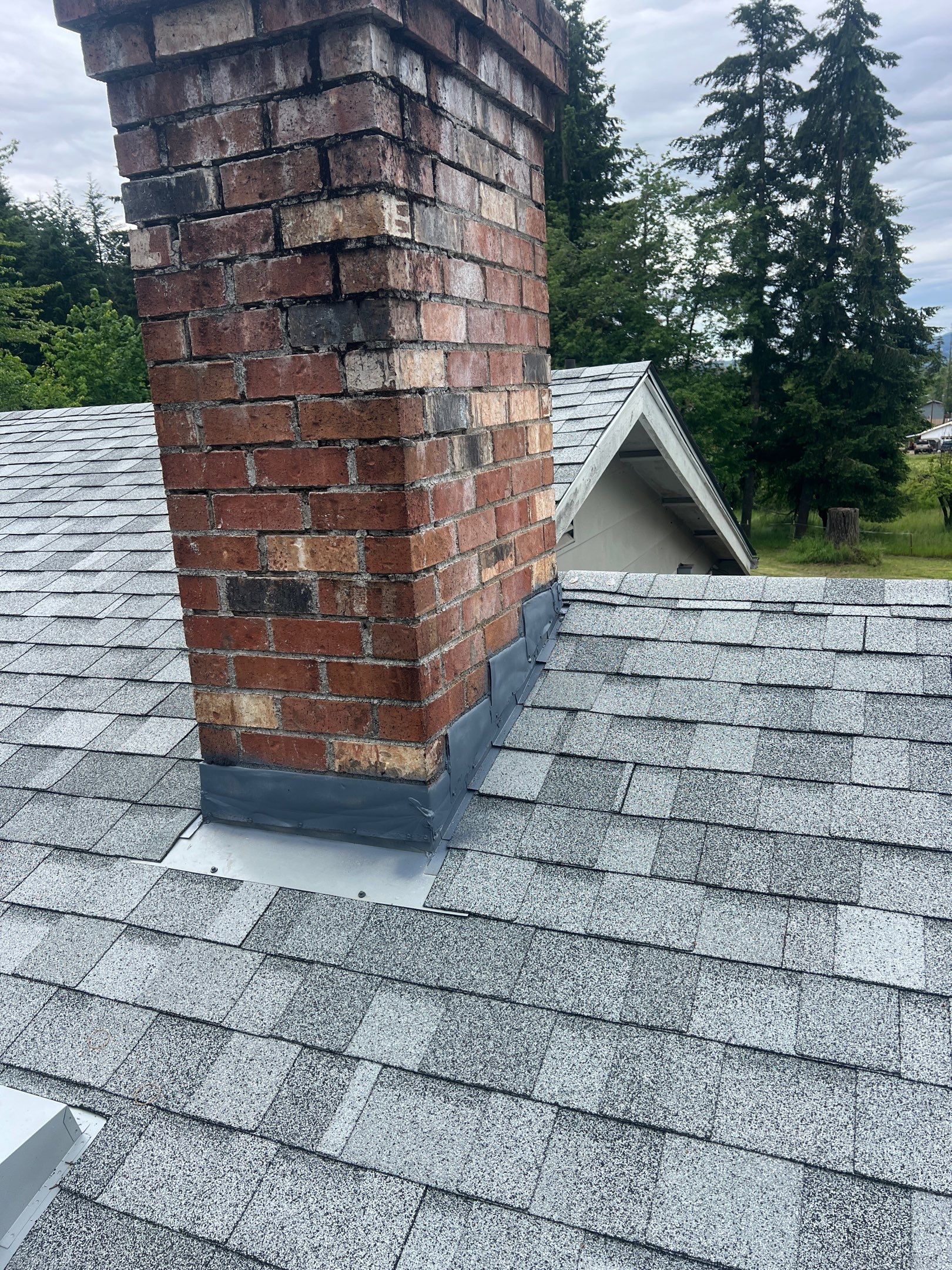 Residential Roofing Installation using IKO Dynasty (Color: Frostone Grey) by Orezona Building & Roofing Company, Inc.
