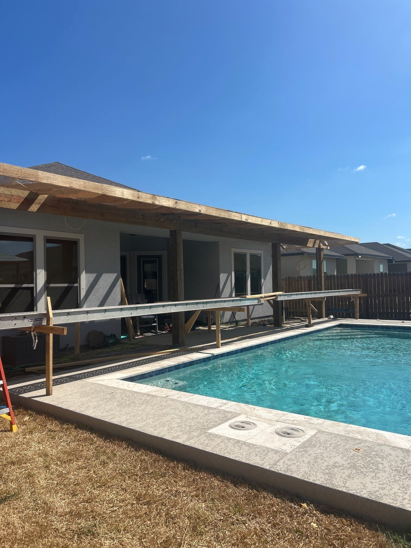 Patio Pool Cover by Bayfront Roofing and Construction