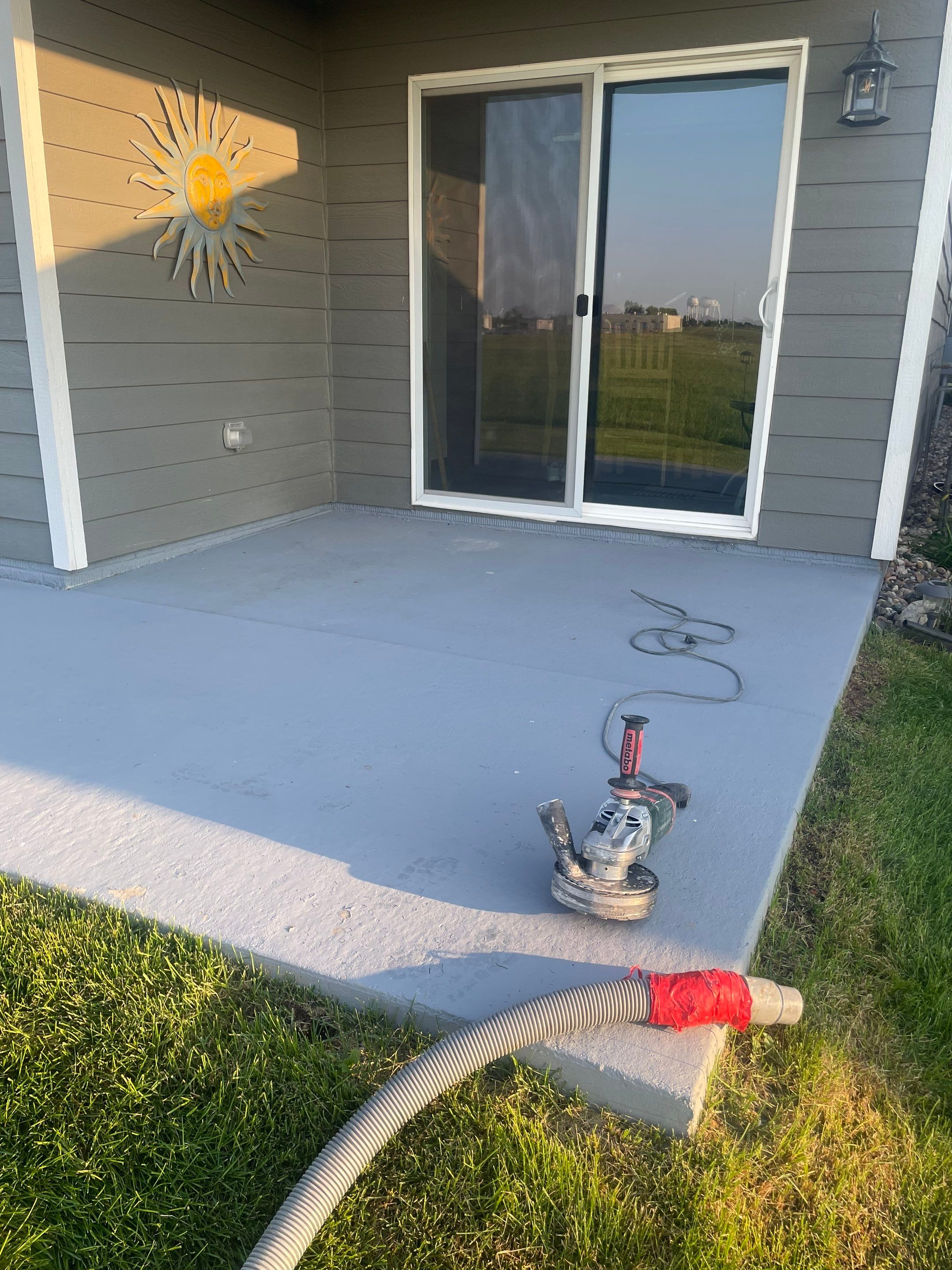 Starry Evening Concrete Patio Coating Installation in Tea by Select Painting, Coatings & Garage Cabinets