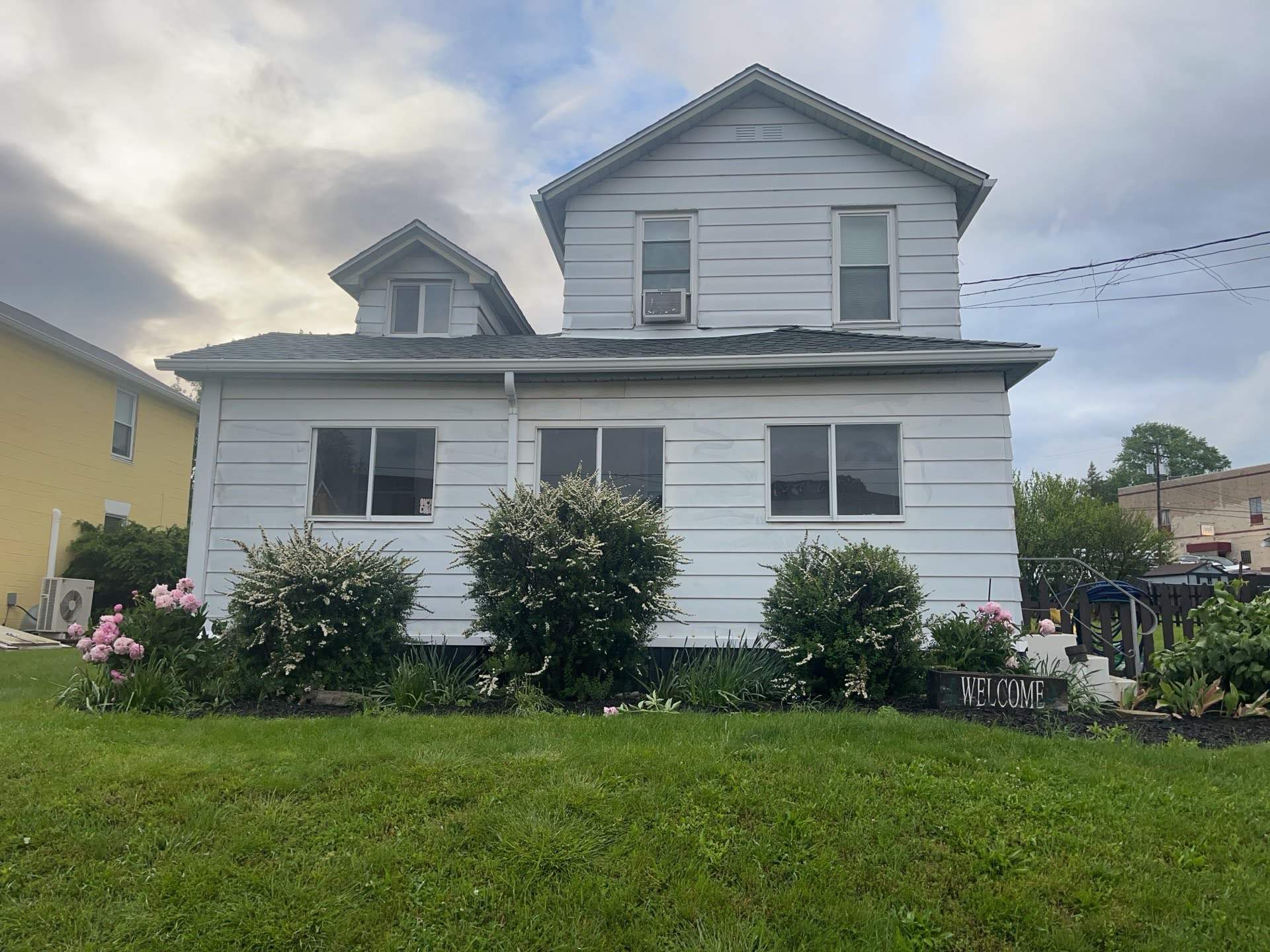 House Siding Renovation with White Vinyl in Bridgeville by Ideal Siding Pittsburgh