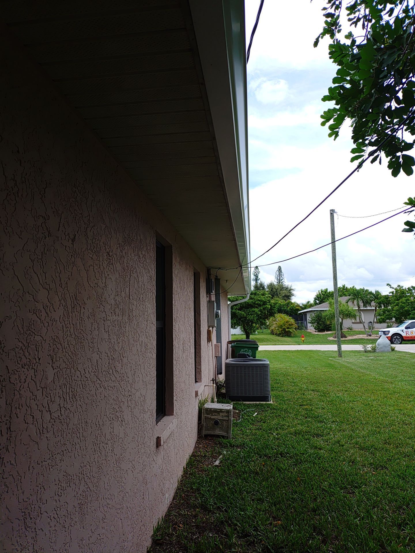 Replace gutter using White Down Spouts in Cape Coral FL by Gutter Professors