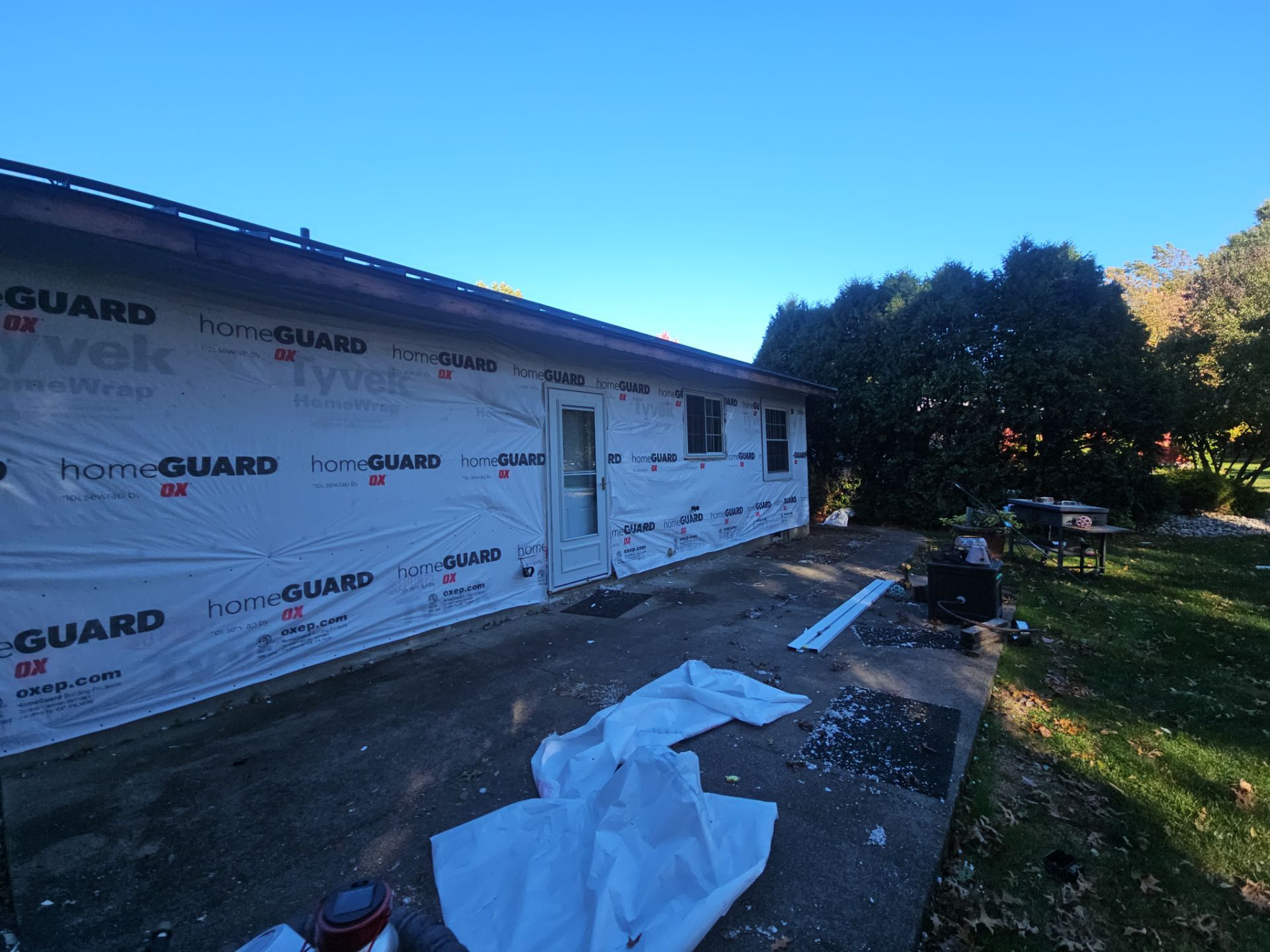 Wadsworth Exterior Transformation Featuring Blue Vertical Siding and Metal Roofing by Cornerstone Roofing And Siding