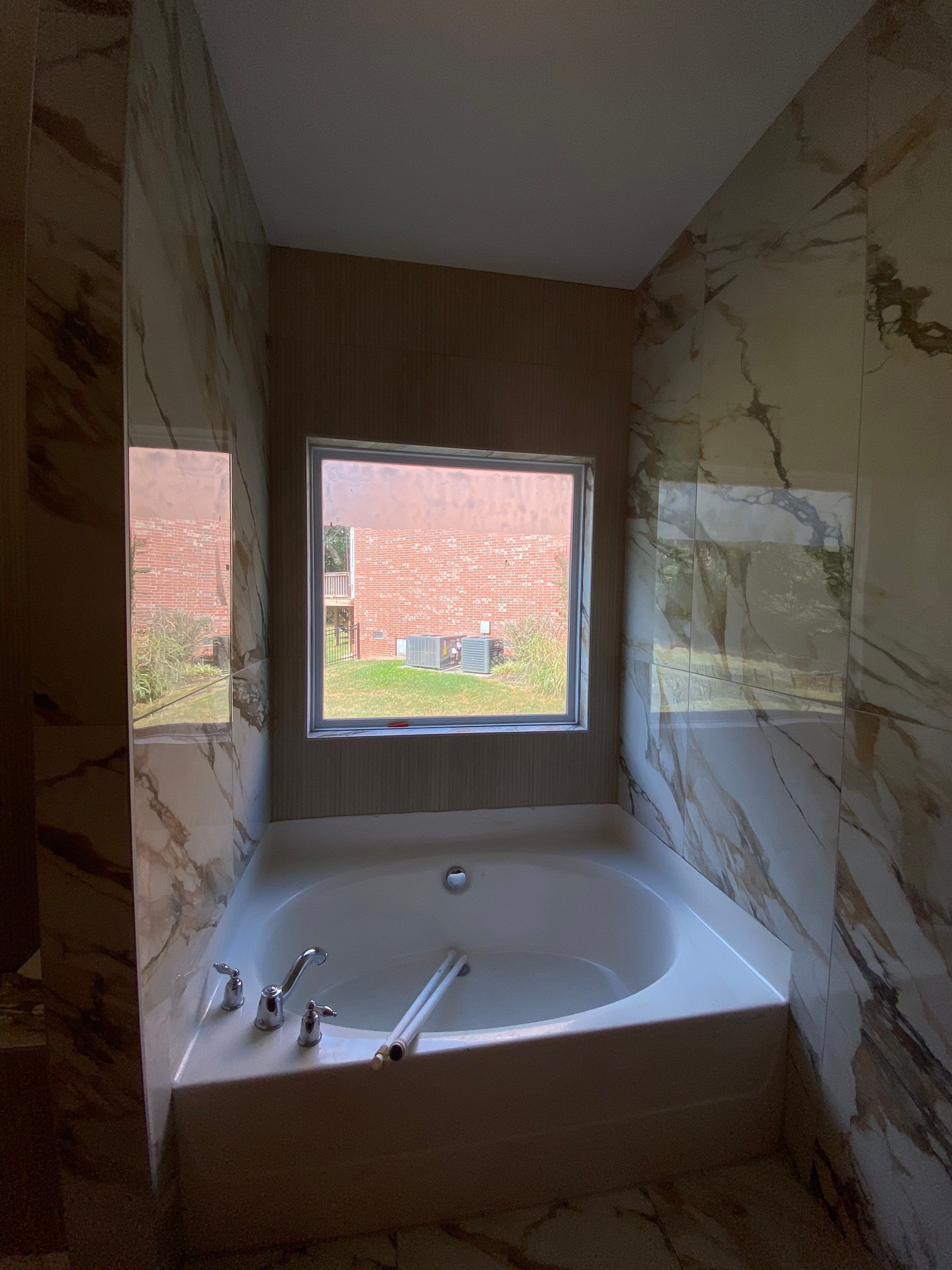Beautiful new custom tile shower, tub surround and accent walls by Footprints Floors of Nashville