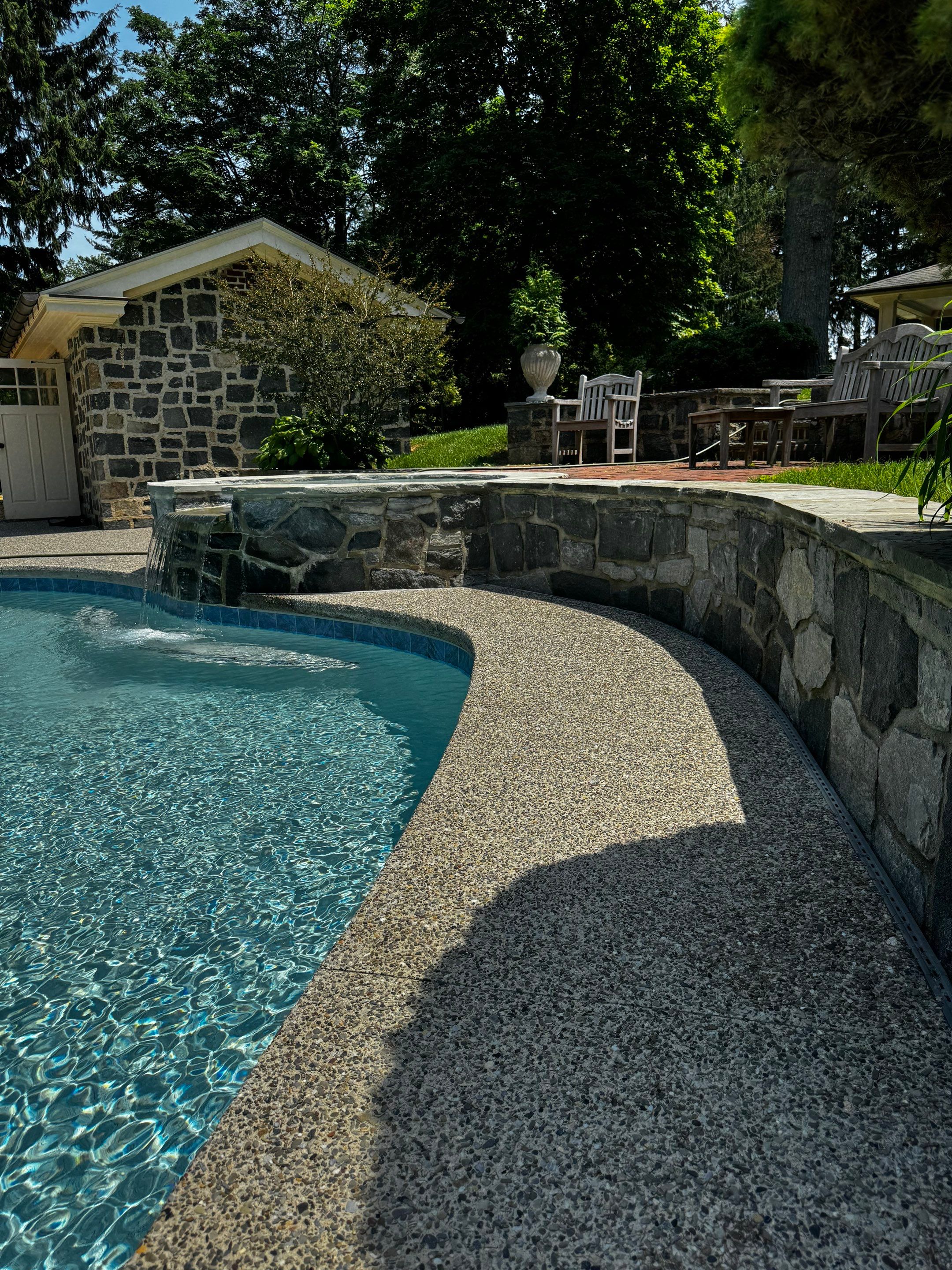 Exposed Aggregate Pool Deck Renovation in Villanova by Architectural Concrete Design