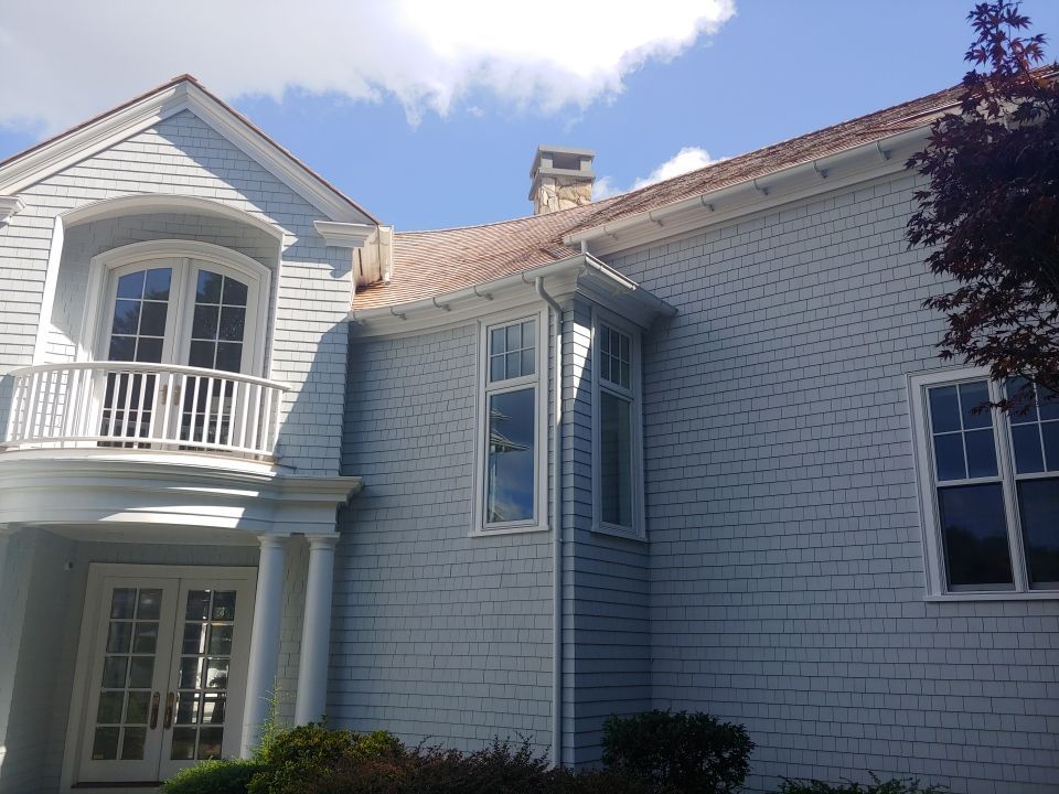 Gutter Installation using 6" Half Round Aluminum Gutter over Crown Moulding by Gutter Pro Enterprises