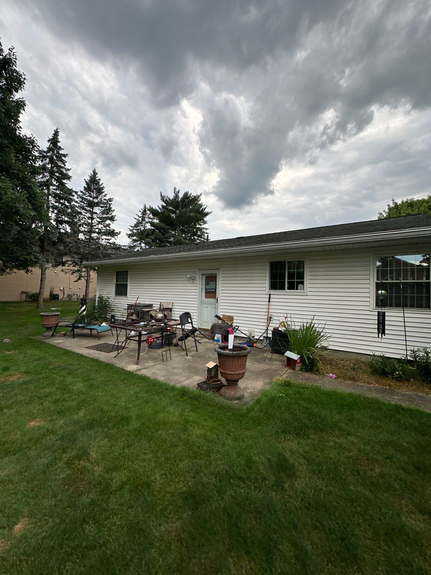 Wadsworth Exterior Transformation Featuring Blue Vertical Siding and Metal Roofing by Cornerstone Roofing And Siding