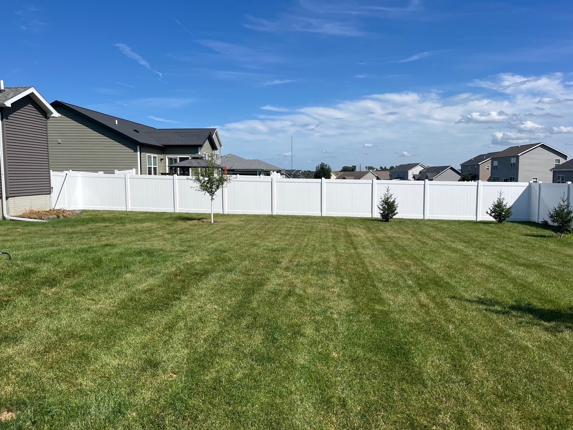 New Vinyl Privacy Fencing and Gates for Waterloo Residential Backyard by Perfect Picket Fence and Stain