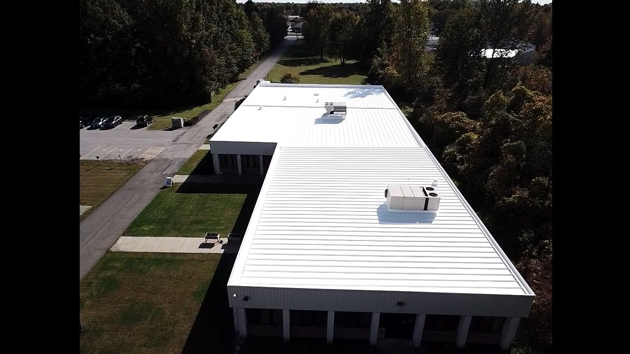 Commercial Metal Roof Coating by Gold Star Roofing LLC