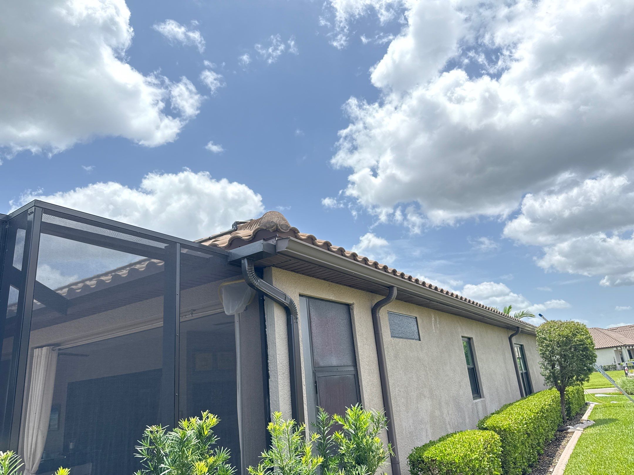 Neighboring Tile Roof Cleaning with Gutter Runoff Control – Palmetto, FL by Sunshine AquaWash