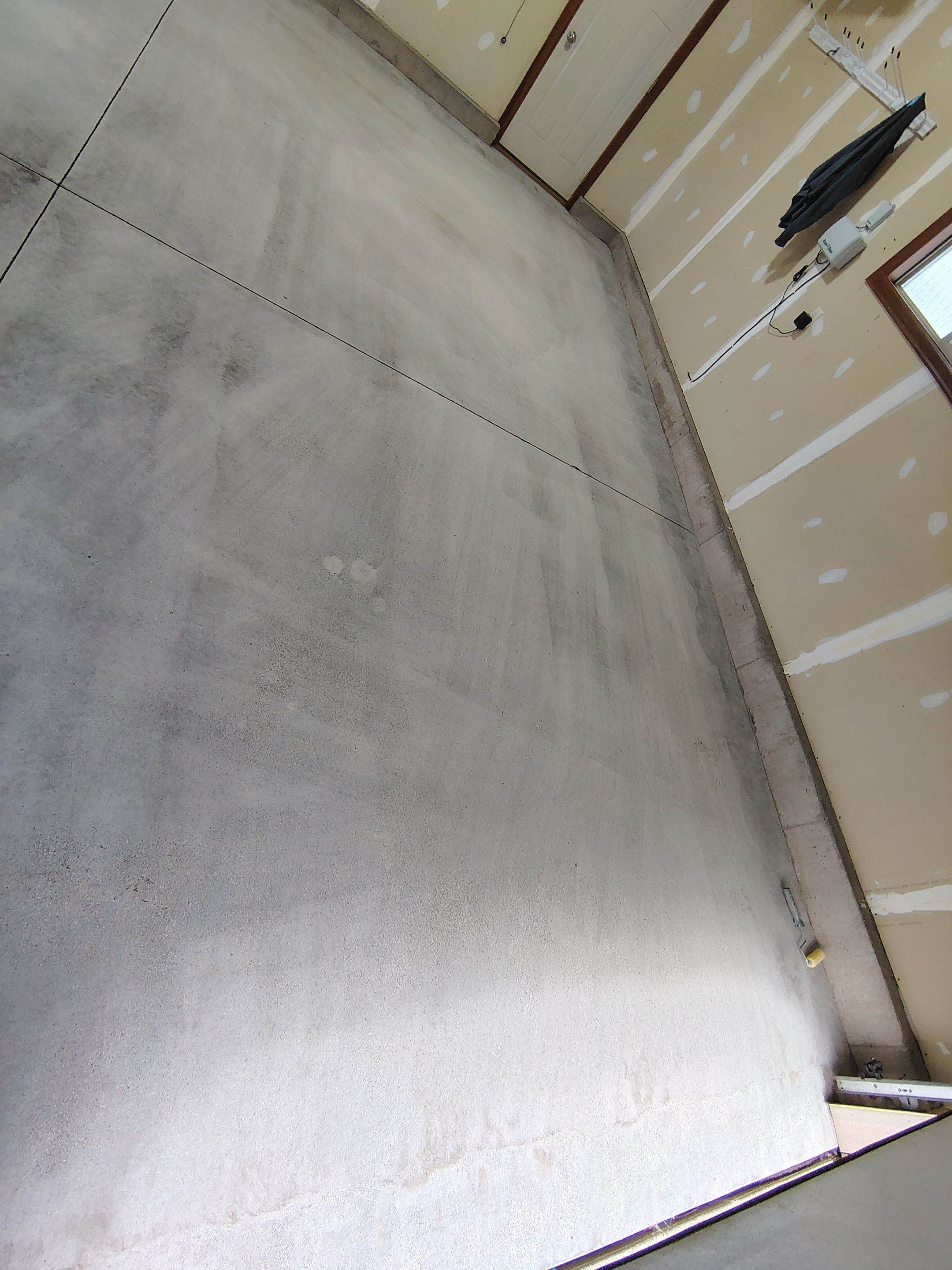 Multi-Car Garage Concrete Coating and Epoxy Finish in Sioux Falls by Select Painting, Coatings & Garage Cabinets