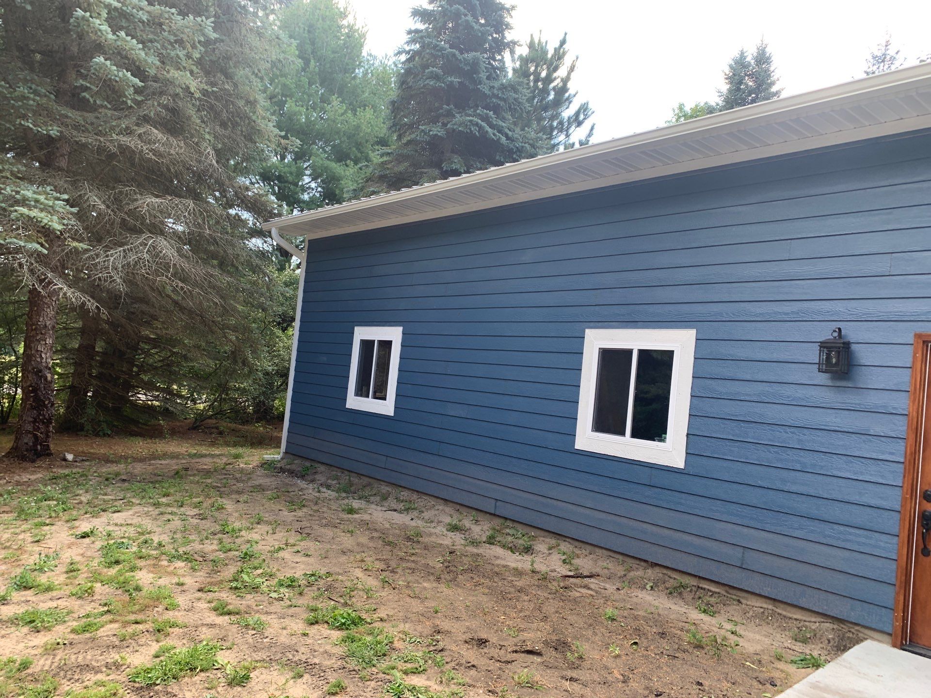 Gutter and Gutter Helmet Installation for Lake Leelanau Home by Rainbow Seamless Systems