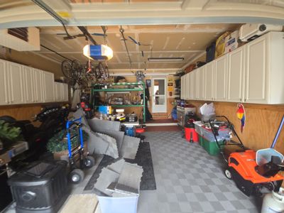 Garage Renovation with Polyaspartic Flooring and Custom Painting in Troy