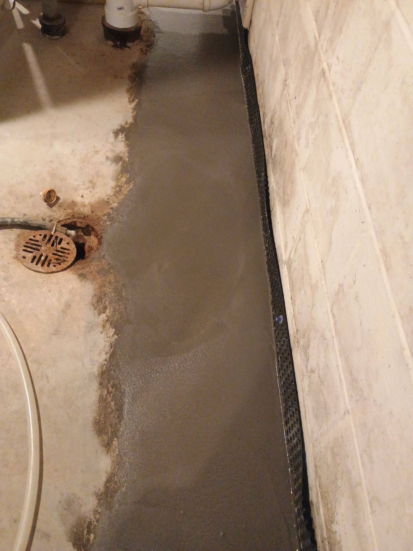 Interior Drain Tile & Buried Discharge in St. Anthony, MN by Waterproofing Northeast