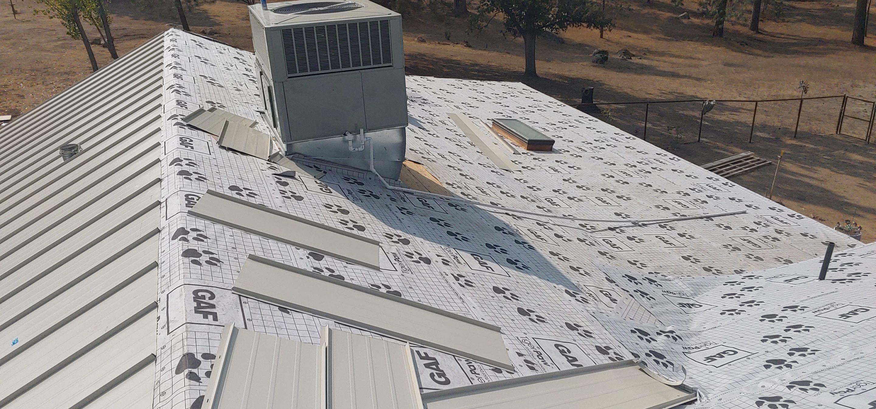 Residential Roofing Installation using Standing seam metal roofing system by Straight Edge Roofing Inc