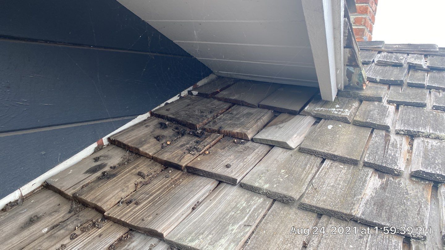 Refurbish and repair shake roof to get ready to sell by Straight Edge Roofing Inc