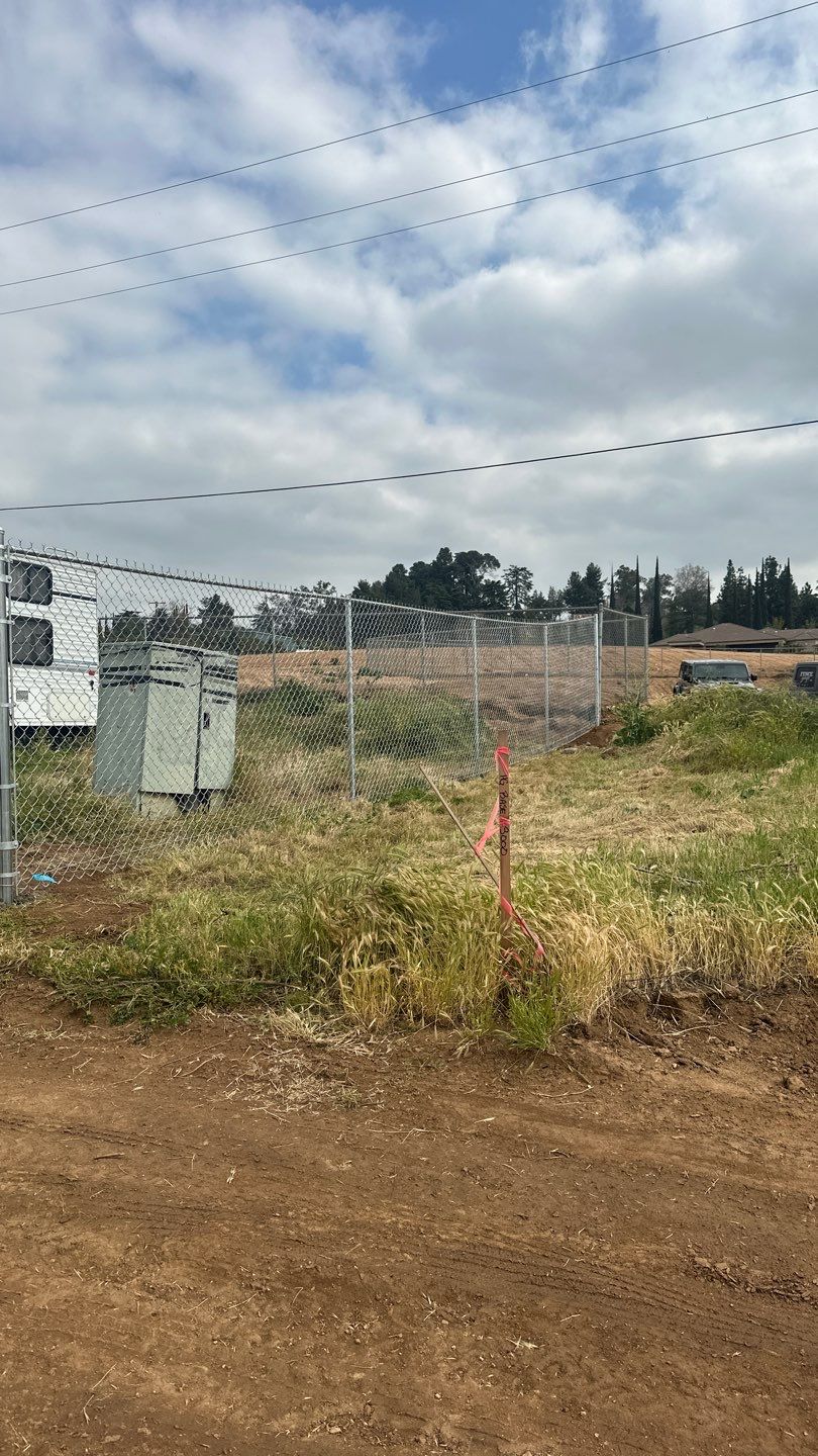 Fence installation using chain link wire by Fence Guys Inc. 
