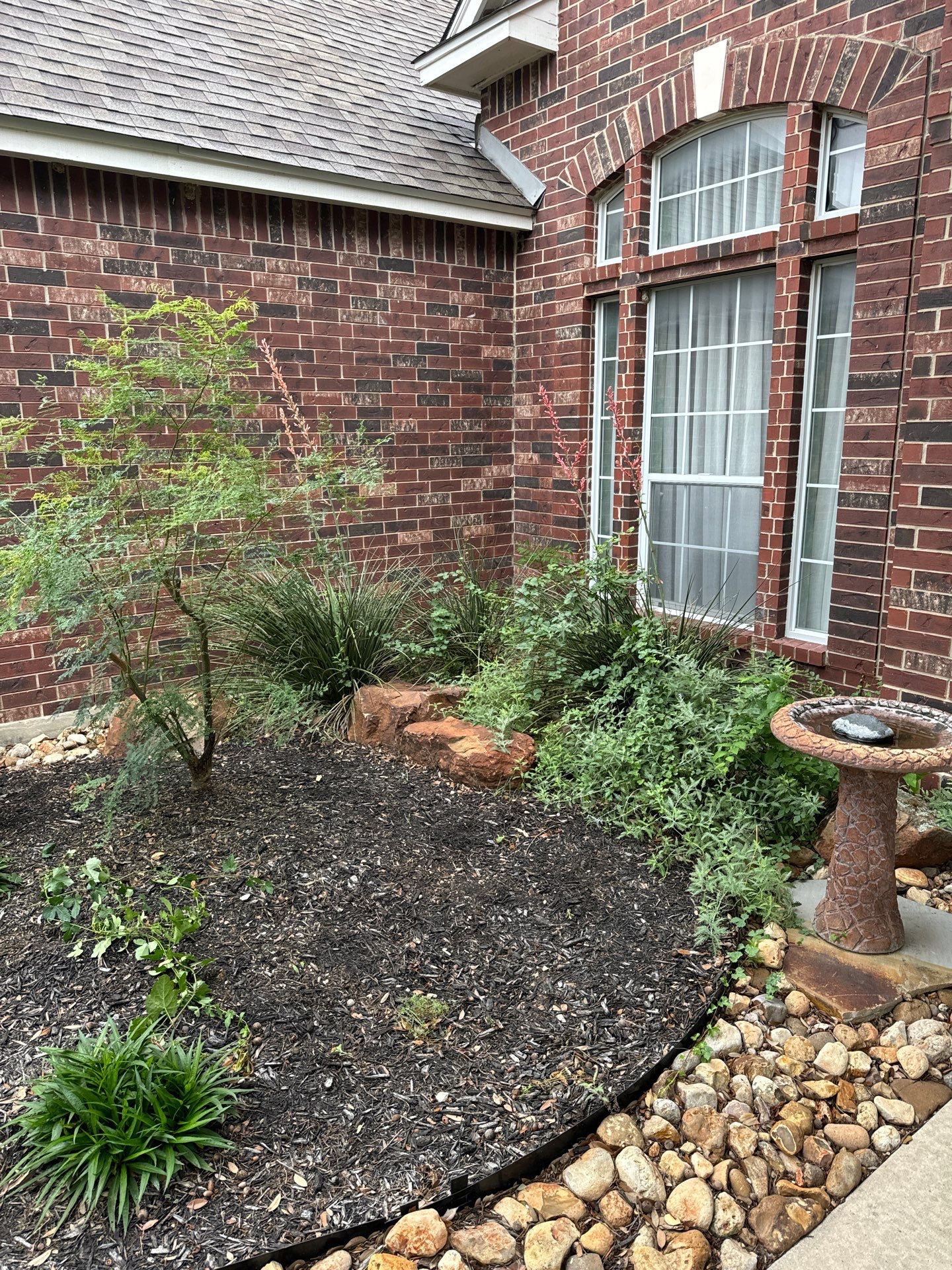 Landscaping Enhancement  using Texas Black Gravel by Hole In One Lawns, LLC