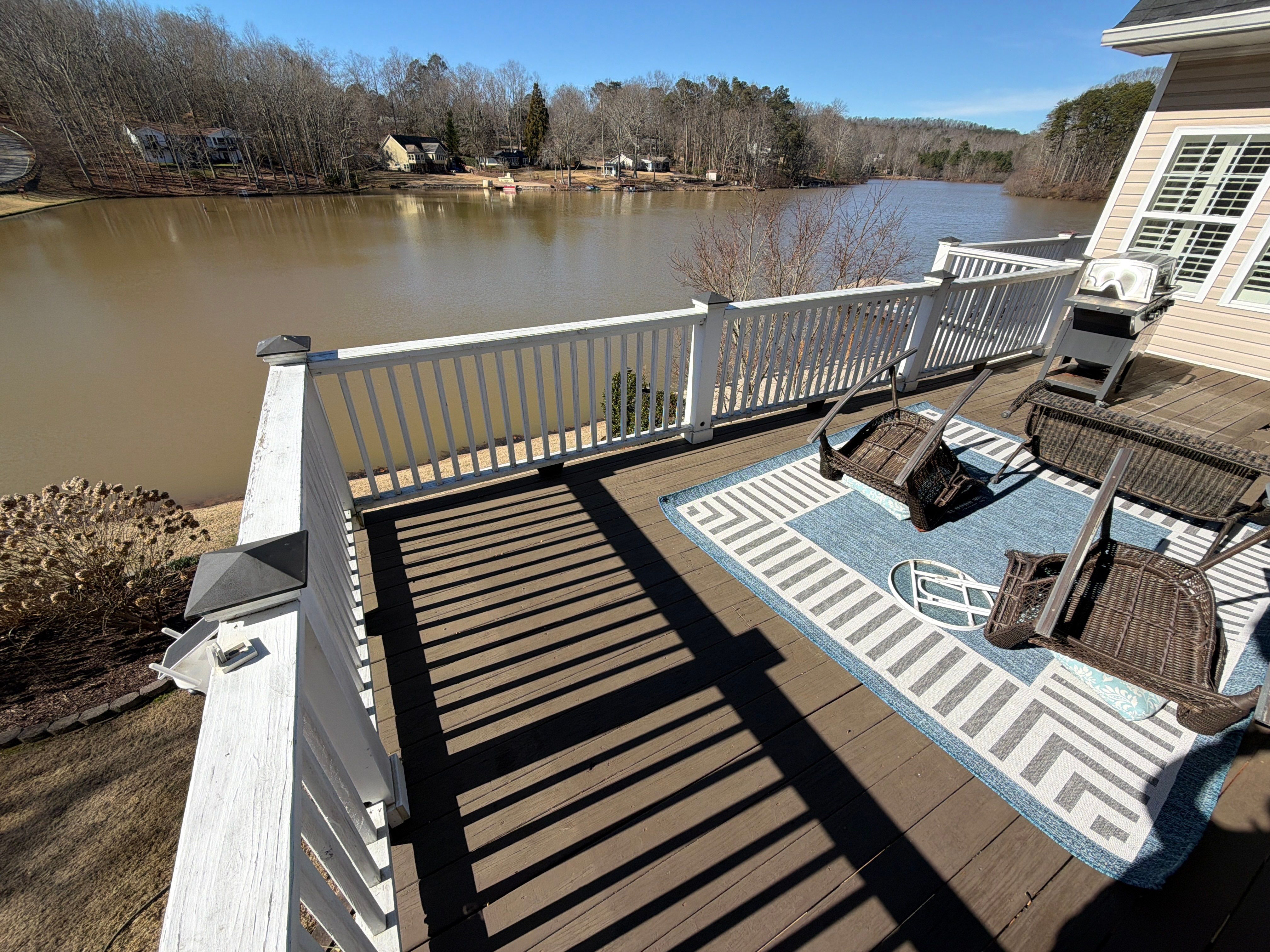 Cumming, GA Lake House Deck Resurface and Extension using Pressure Treated Pine and Skyline Cable Railing by Nelson Exteriors 