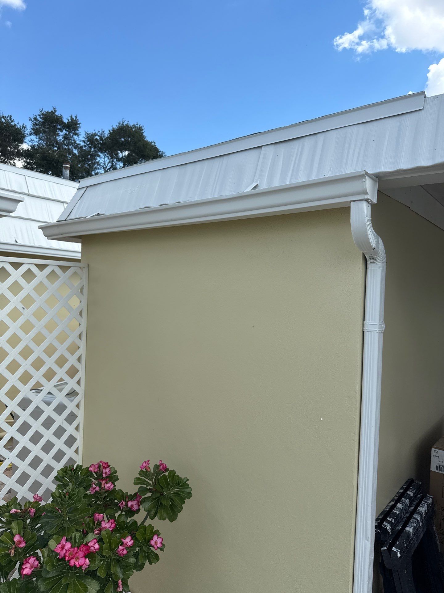 White Gutters and Matching Downspouts in Sarasota FL by Gutter Professors