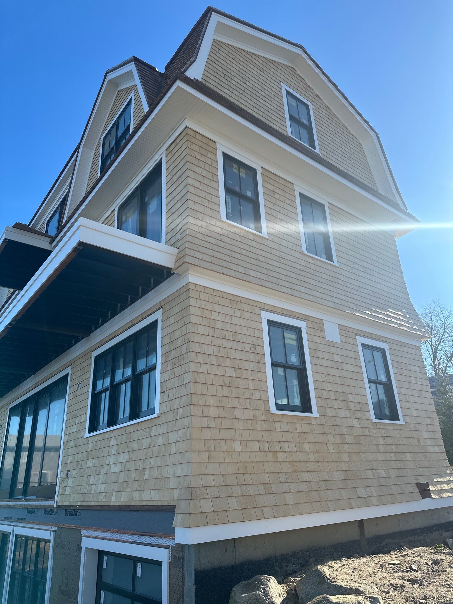 Great Island - Red Cedar Roofing, Yellow Cedar Siding, Standing Seam Copper, & Copper Gutters  by Rinaldi Brothers