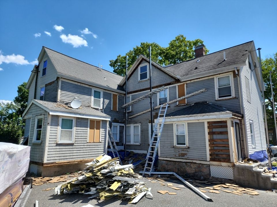 Vinyl siding layover project for 2 family in Wellesley, MA by UBrothers Construction