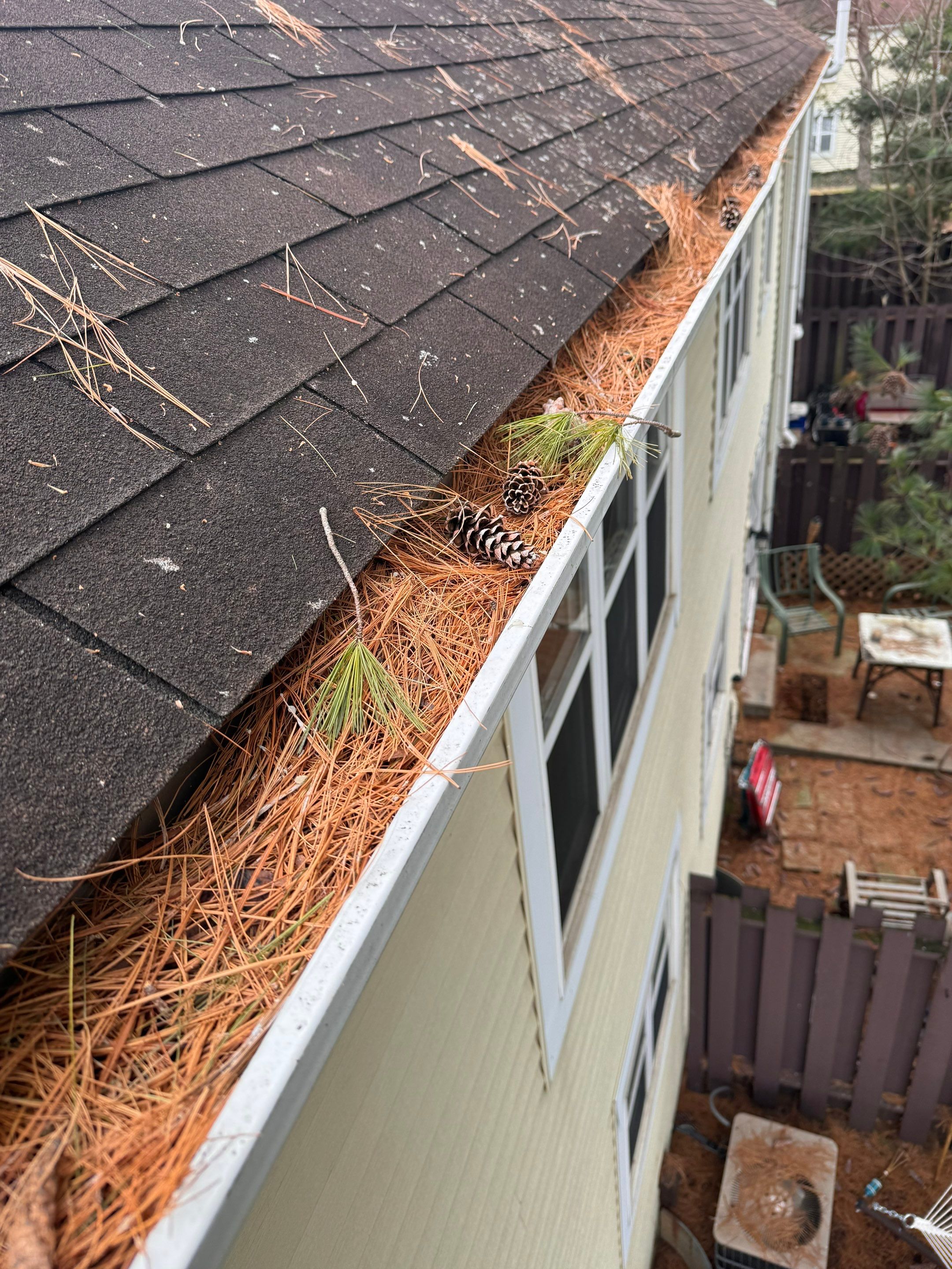 Commercial gutter cleaning Charleston, WV before photo with filled gutters