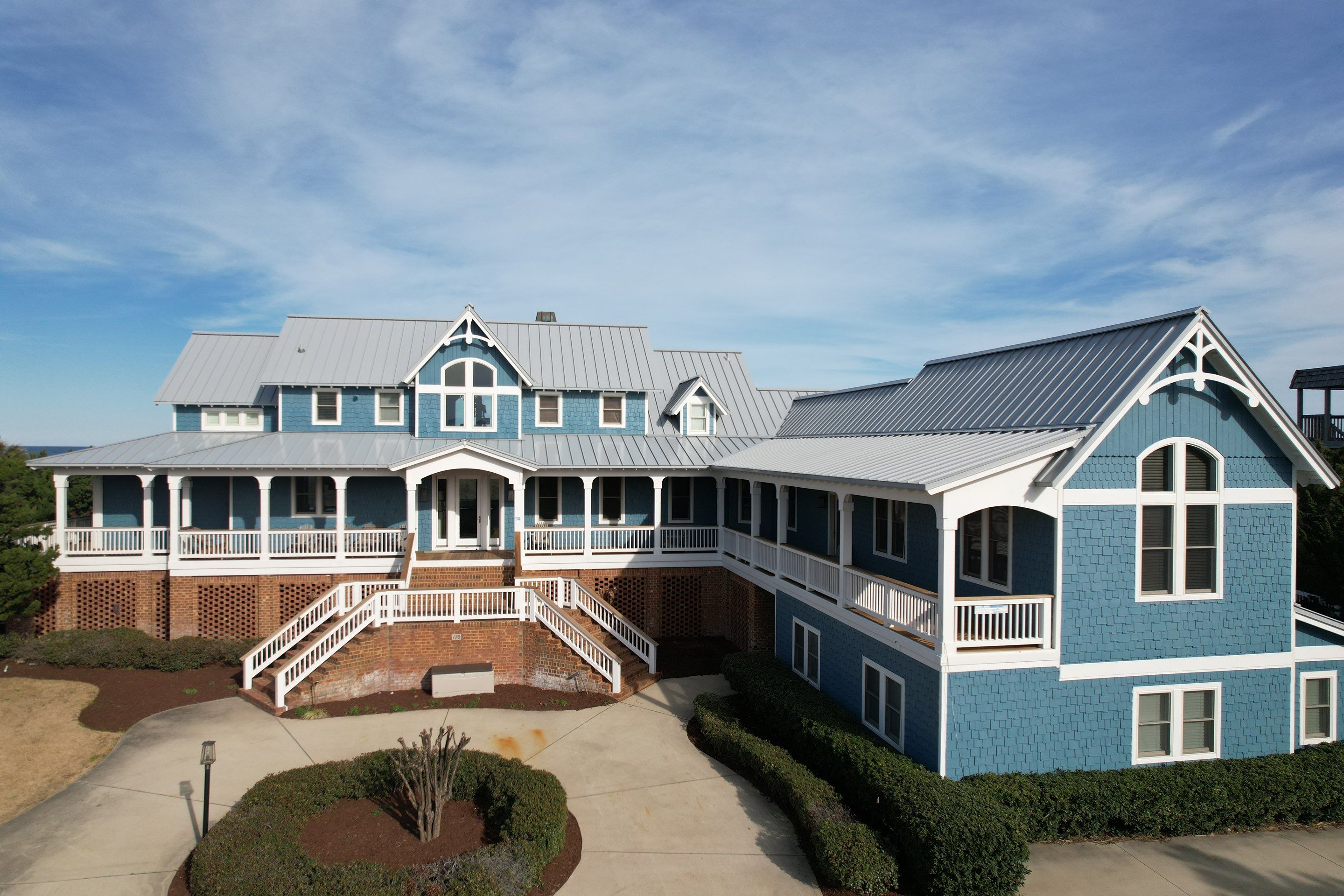 Large Metal Roof Transformation by Gallop Roofing & Remodeling, Inc.