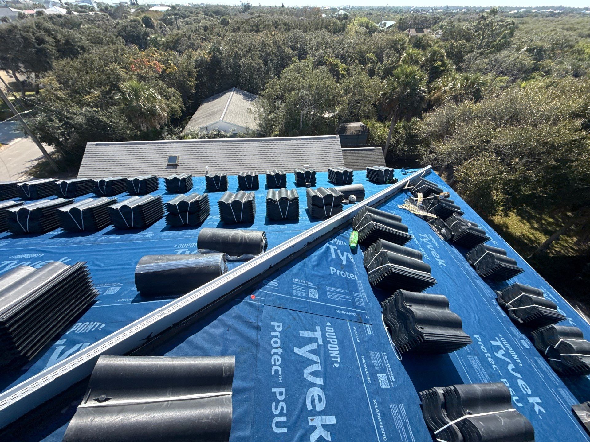 Flagler Beach Residential Tile Roof Replacement with Dark Barrel Tiles by Fortified Roofing Solutions Corp.