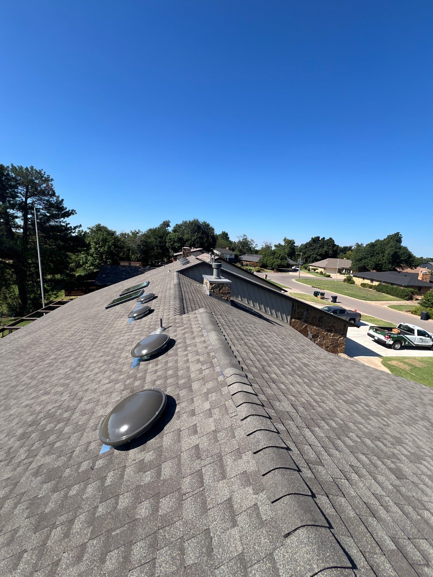 Roof Replacement and Skylight Replacement in Yukon by McCann's Roofing and Construction