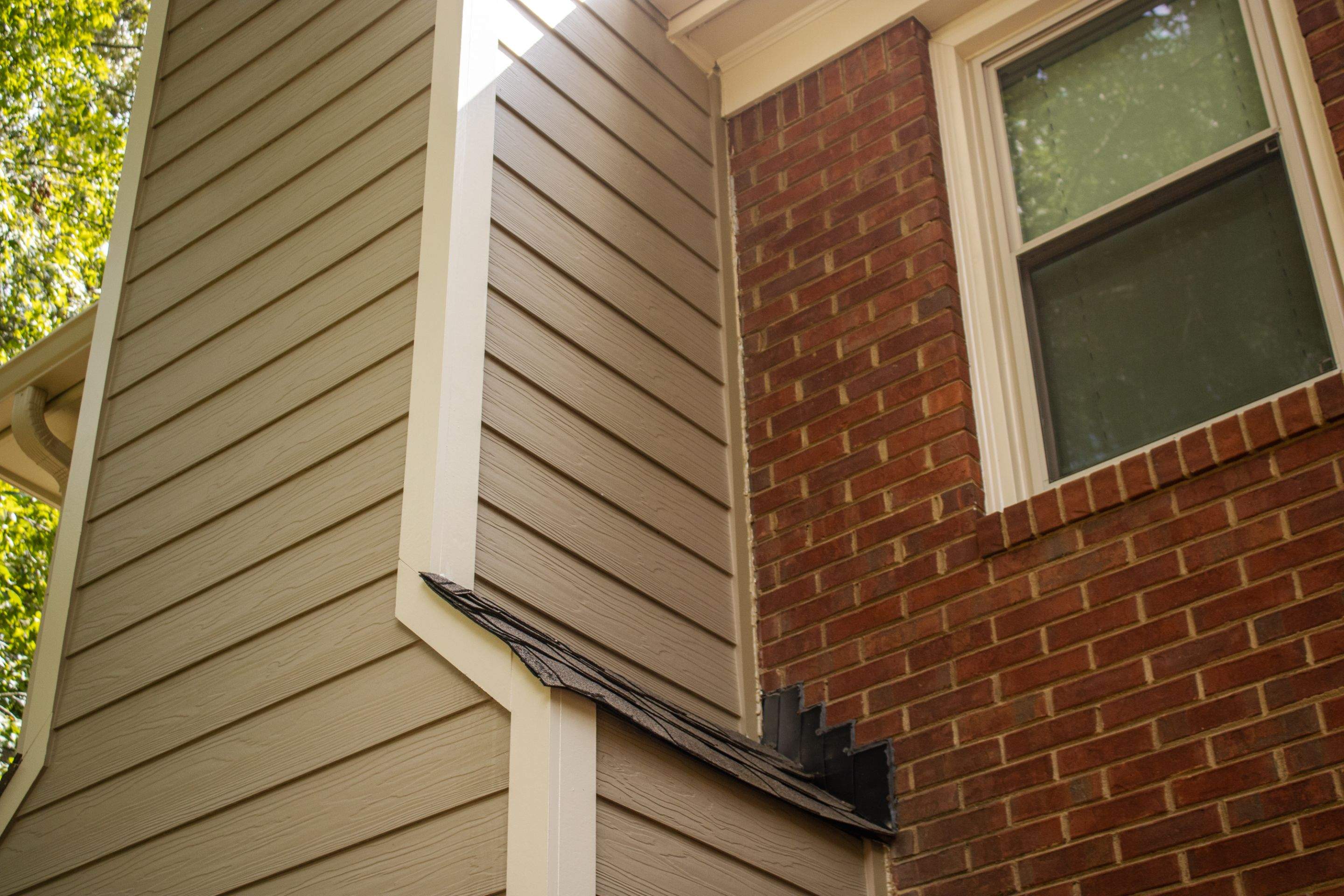 Marietta, GA Rotten Wood Replacement, Chimney Corner Board Installation, Gutter Replacement, and Exterior Painting by Nelson Exteriors