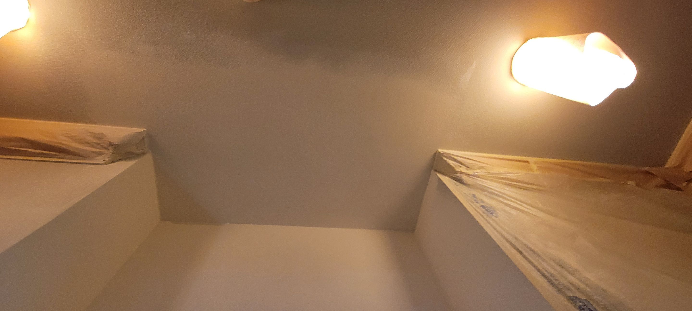 Closet transformation to coffee nook with custom shelves and LED lighting. by Crm Services Llc