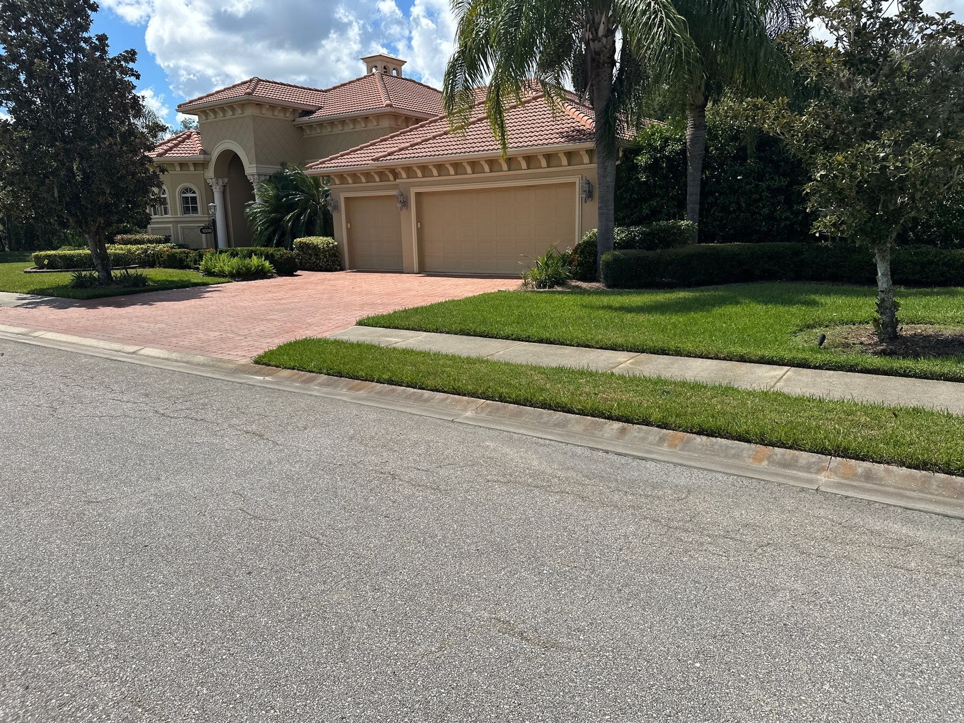 Paver Driveway, Entryway, Sidewalk, and Street Curbing Cleaning in Winding River Community, Bradenton, FL by Sunshine AquaWash