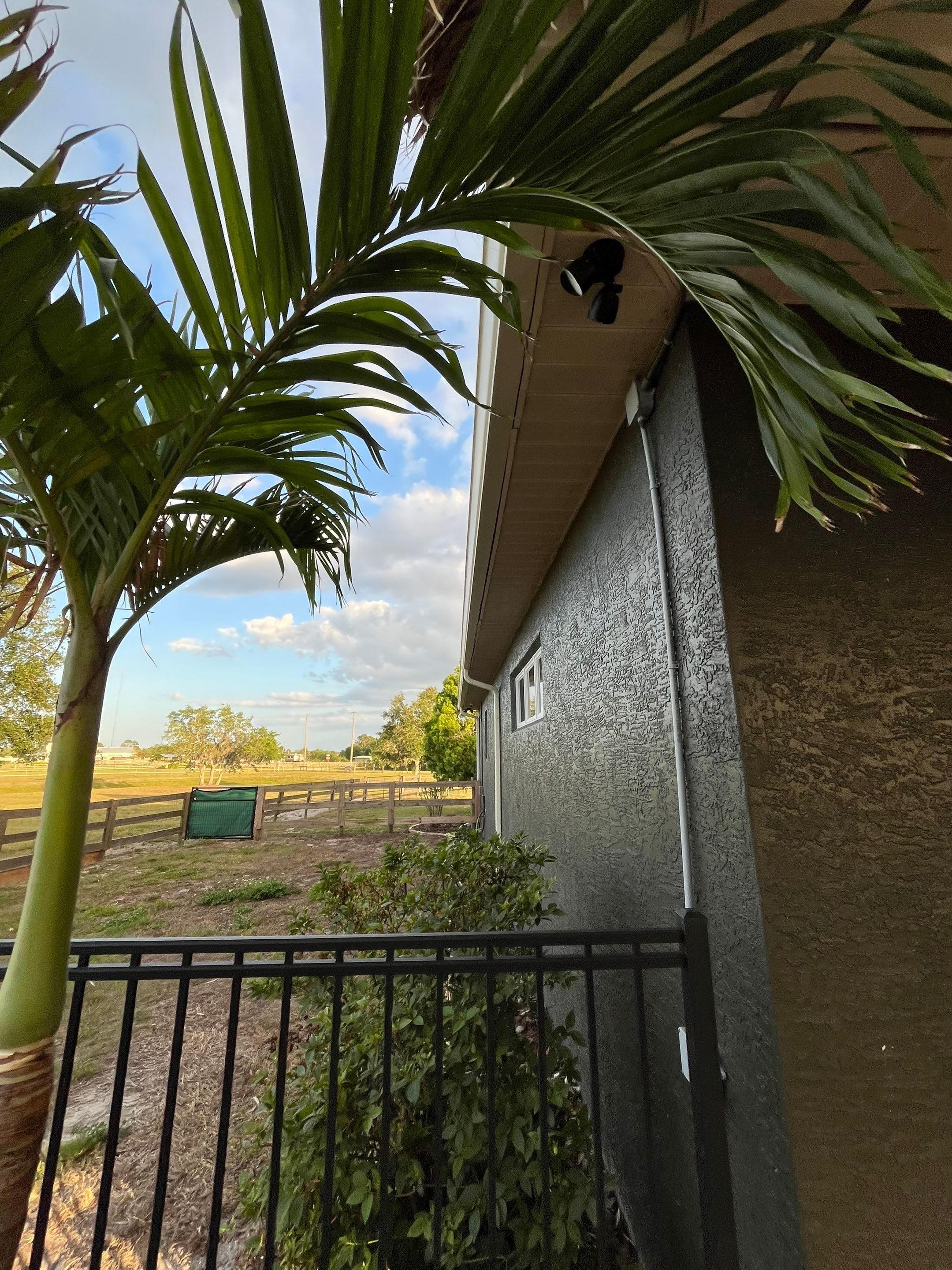  7-inch White seamless gutters and downspouts in Myakka City FL by Gutter Professors