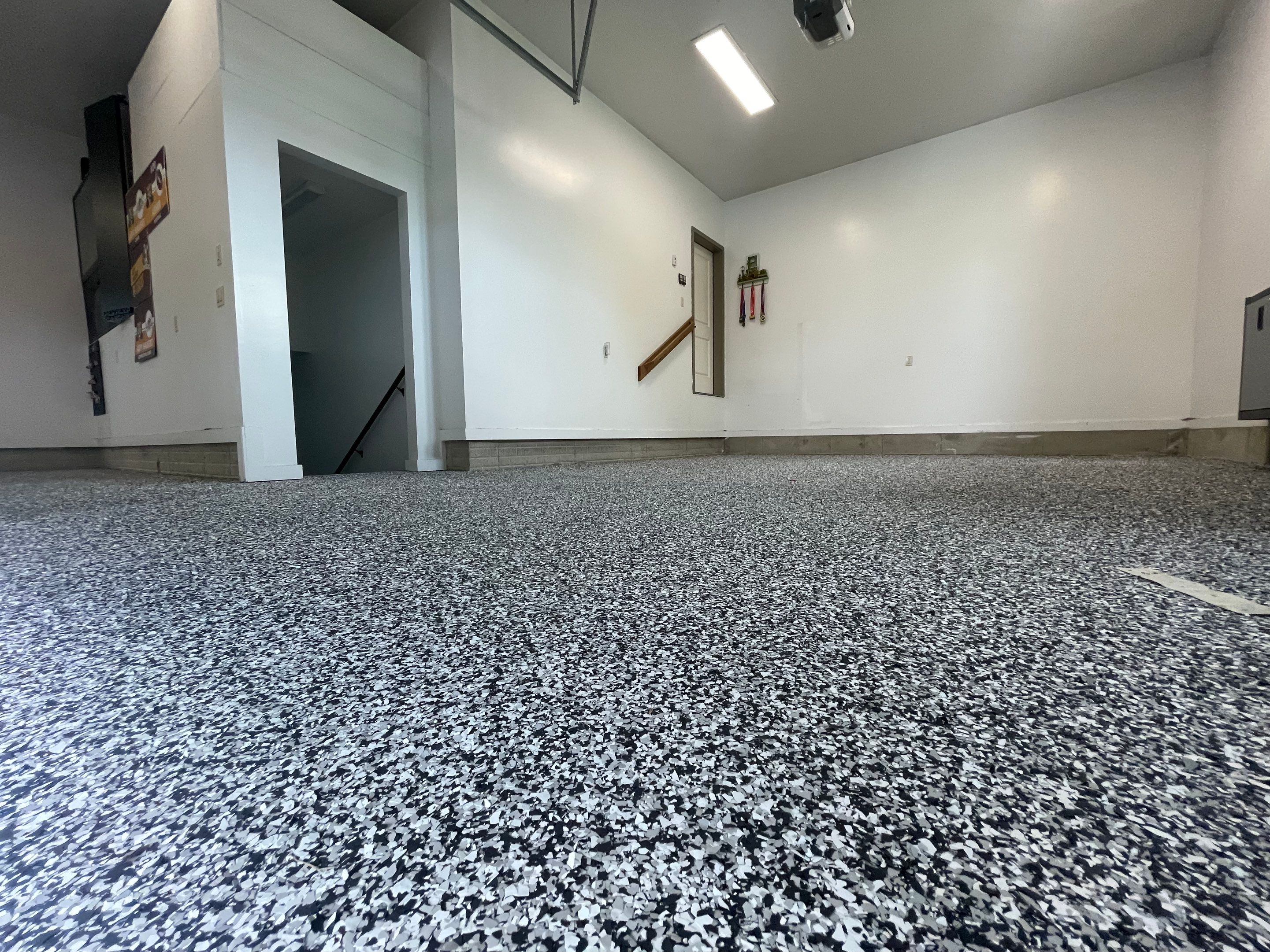 Garage Floor Coating and Domino Flake Finish in Sioux Falls by Select Painting, Coatings & Garage Cabinets