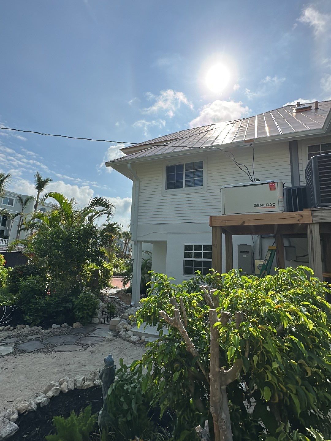 White K-Style Gutters Installed with White Downspouts in Sanibel FL by Gutter Professors