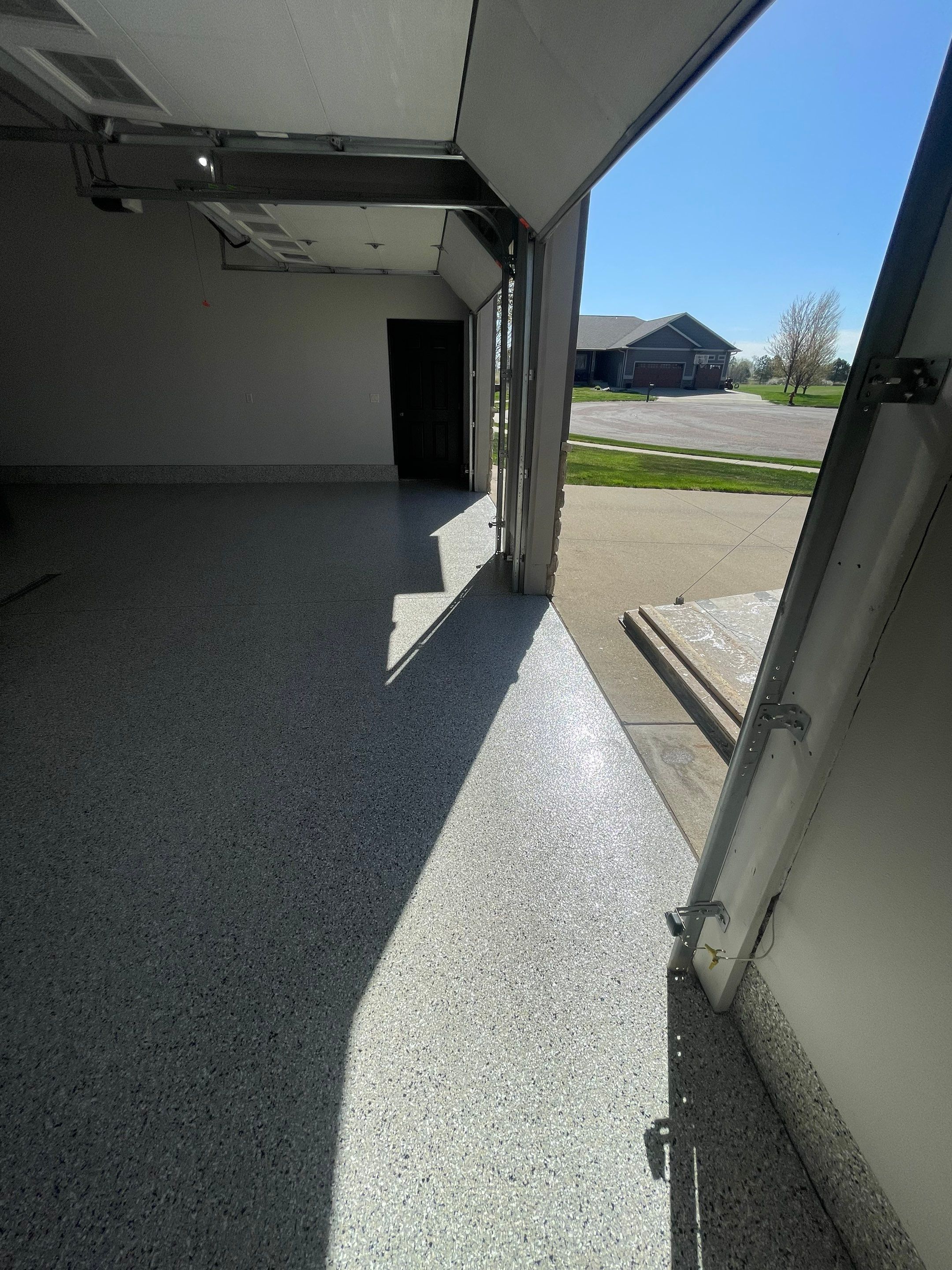 Multi-Car Garage Epoxy Floor Coating in Beresford by Select Painting, Coatings & Garage Cabinets
